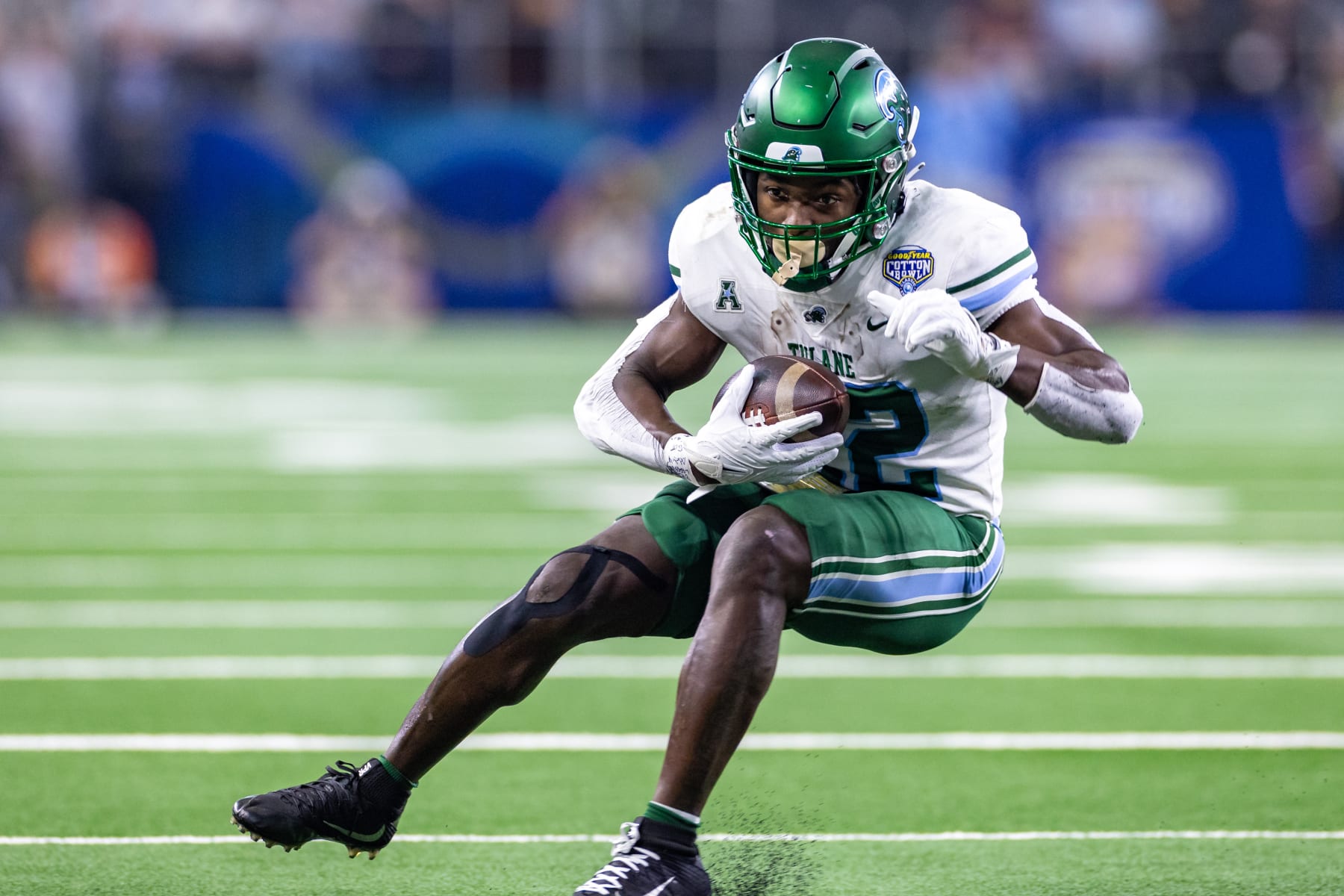 ARLINGTON, TX - JANUARY 02: Tulane Green Wave running back Tyjae Spears (#22) runs up field during the Goodyear Cotton Bowl game between the USC Trojans and Tulane Green Wave on January 02, 2023 at AT&T Stadium in Arlington, TX.  (Photo by Matthew Visinsky/Icon Sportswire via Getty Images)