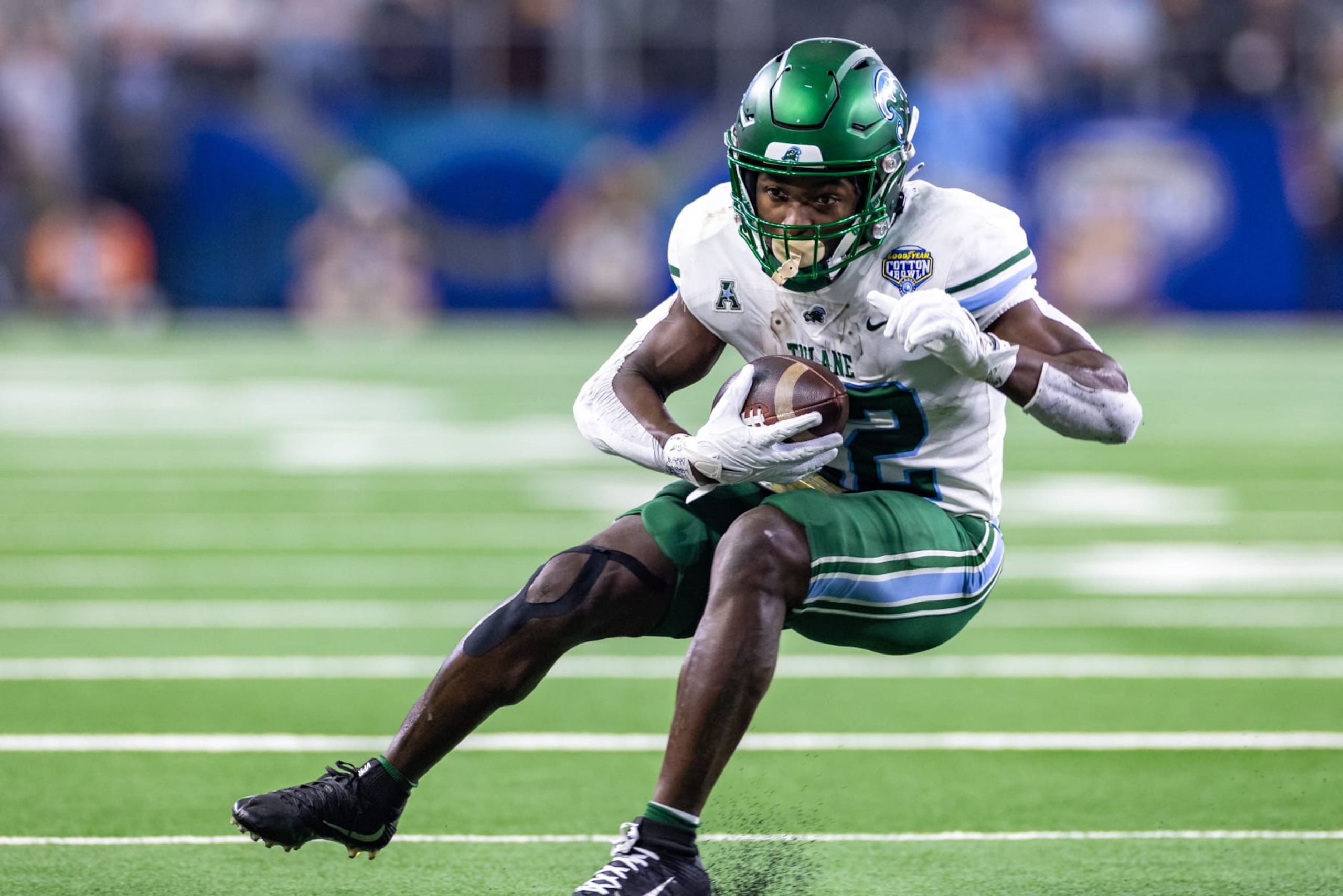 ARLINGTON, TX - JANUARY 02: Tulane Green Wave running back Tyjae Spears (#22) runs up field during the Goodyear Cotton Bowl game between the USC Trojans and Tulane Green Wave on January 02, 2023 at AT&T Stadium in Arlington, TX.  (Photo by Matthew Visinsky/Icon Sportswire via Getty Images)