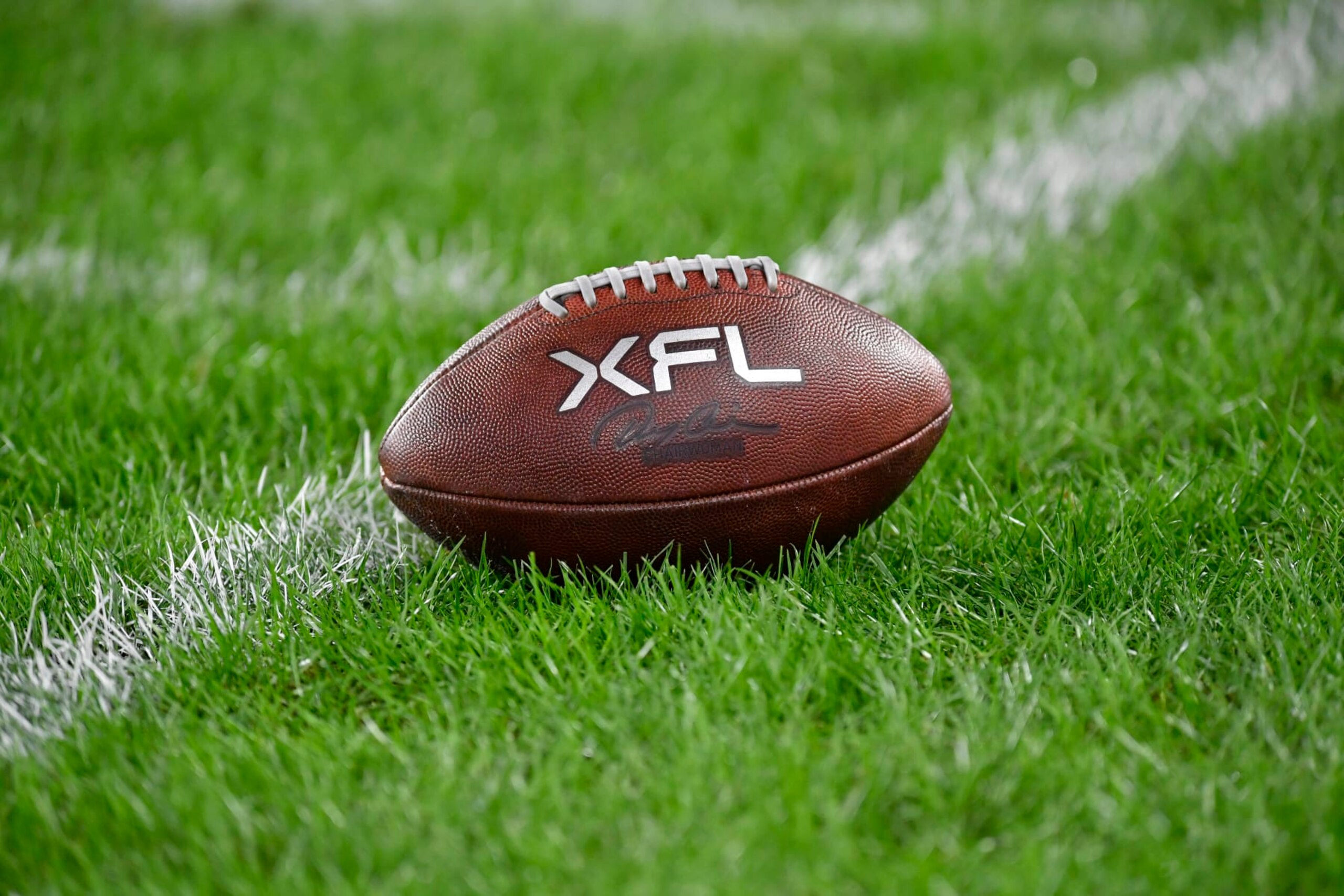 WASHINGTON, DC - FEBRUARY 19: A close up of an XFL leather game football on natural turf grass during the Seattle Sea Dragons versus D.C. Defenders XFL football game on February 19, 2023 at Audi Field in Washington, D.C.. (Photo by Randy Litzinger/Icon Sportswire via Getty Images)