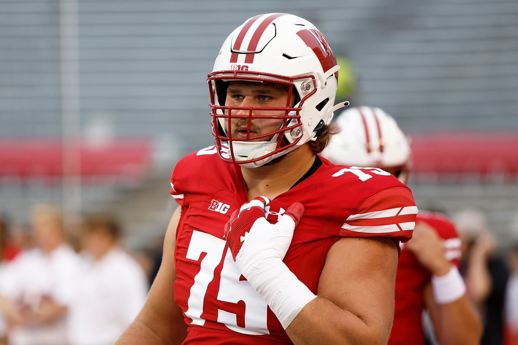 MADISON, WISCONSIN - SEPTEMBER 03: Joe Tippmann #75 of the Wisconsin Badgers warms up prior to the start of the game against the Illinois State Redbirds at Camp Randall Stadium on September 03, 2022 in Madison, Wisconsin. (Photo by John Fisher/Getty Images)