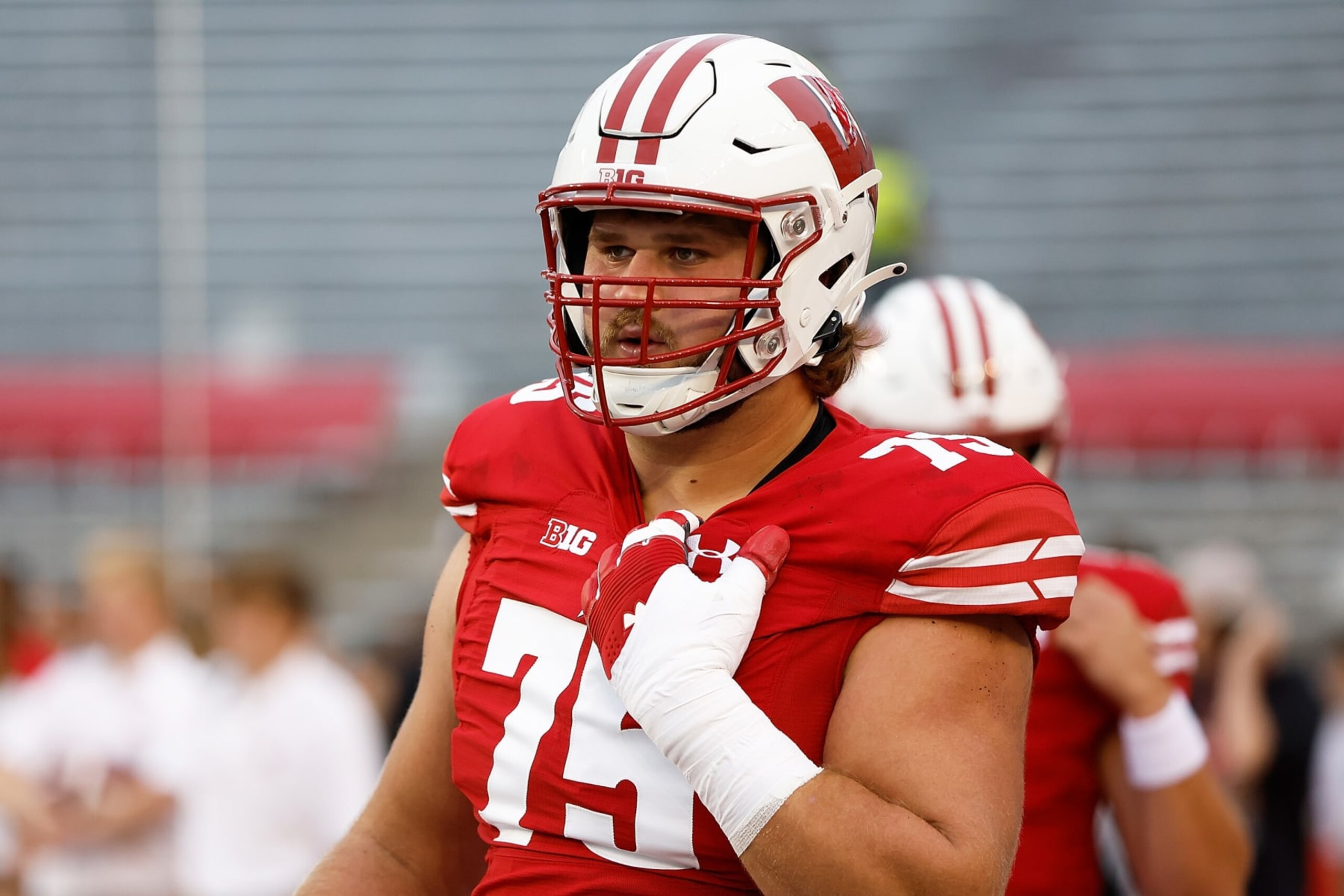 MADISON, WISCONSIN - SEPTEMBER 03: Joe Tippmann #75 of the Wisconsin Badgers warms up prior to the start of the game against the Illinois State Redbirds at Camp Randall Stadium on September 03, 2022 in Madison, Wisconsin. (Photo by John Fisher/Getty Images)