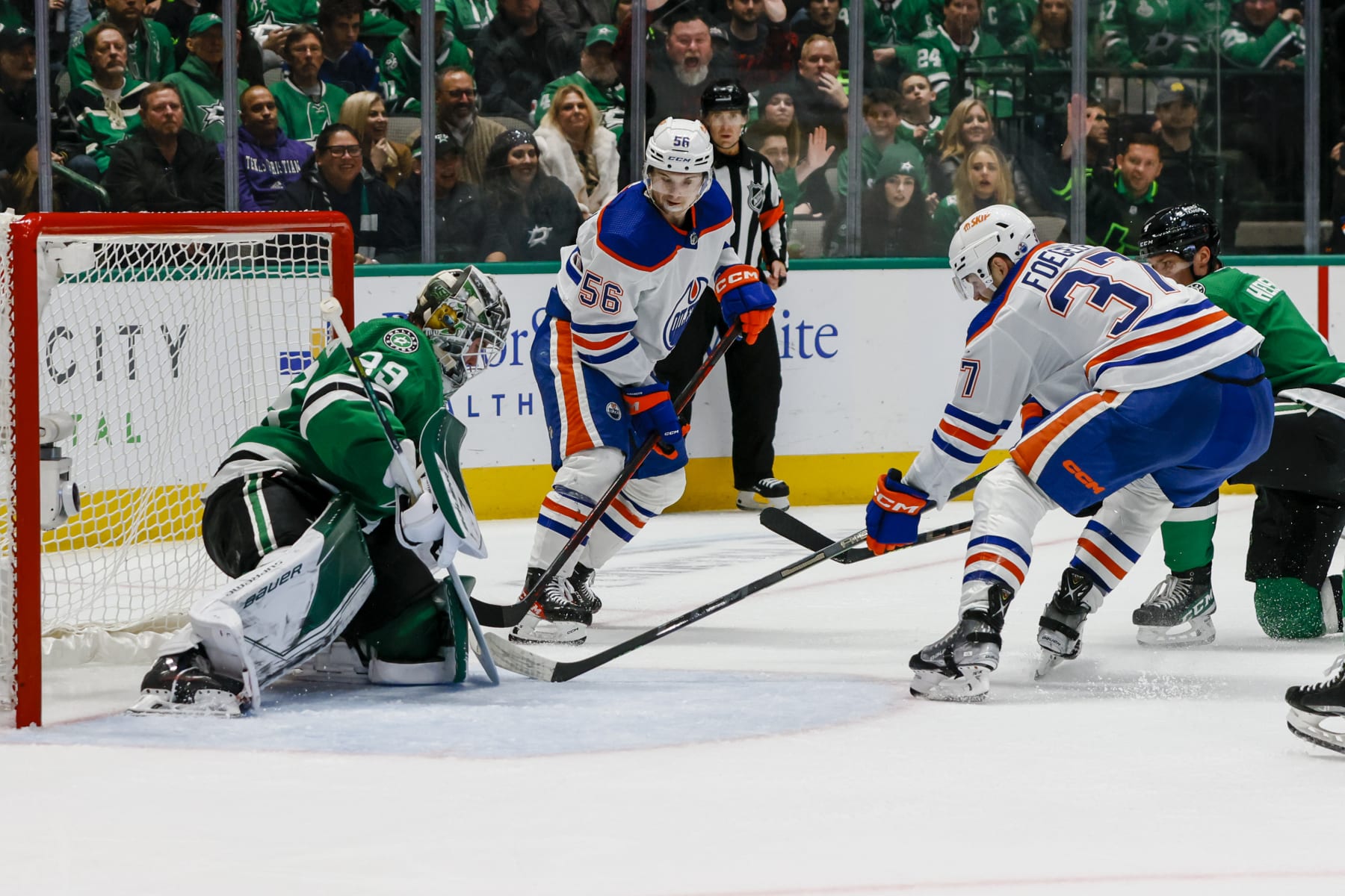Edmonton Oilers forwards Kailer Yamamoto (left) and Warren Foegele in action against the Dallas Stars.