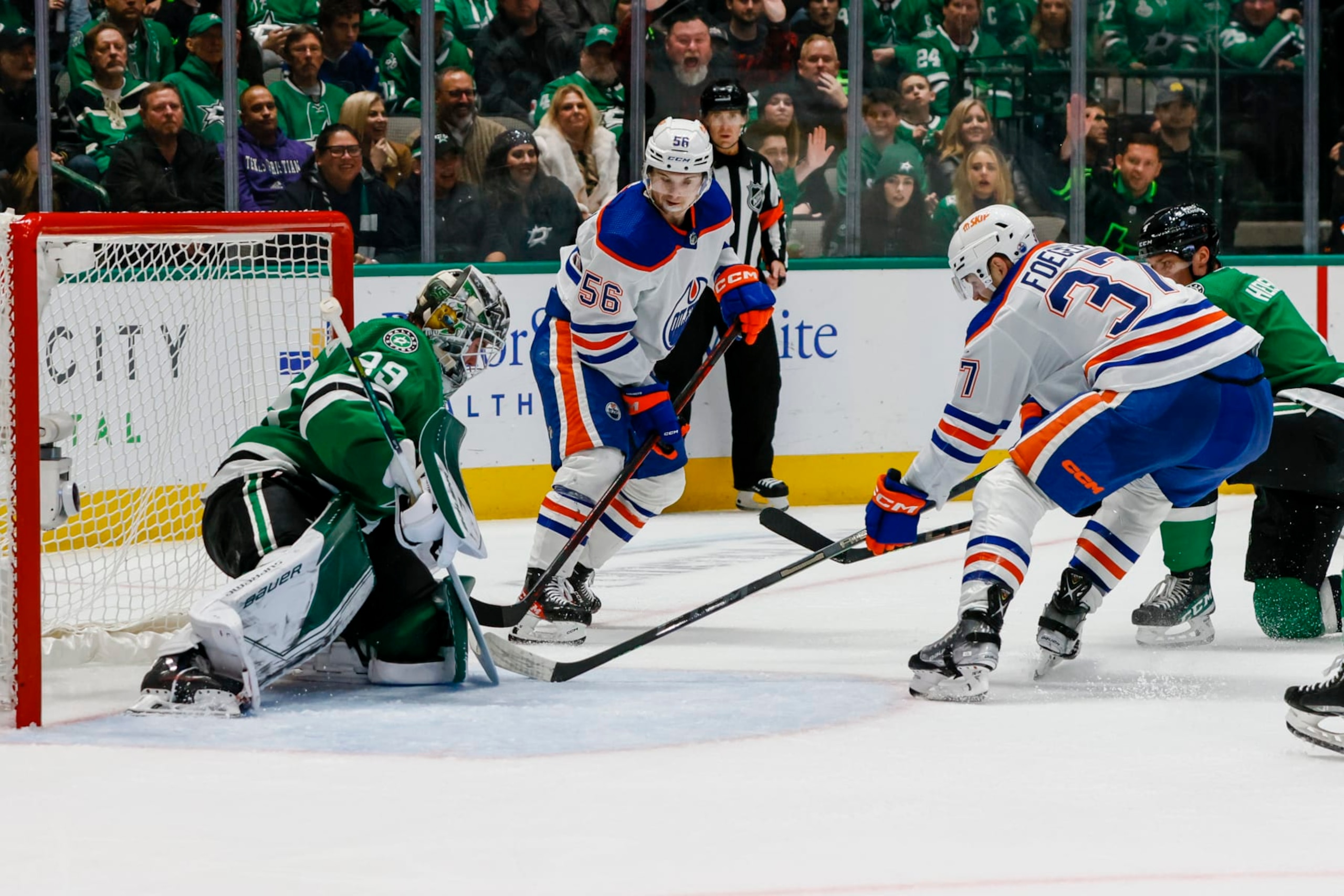 Edmonton Oilers forwards Kailer Yamamoto (left) and Warren Foegele in action against the Dallas Stars.