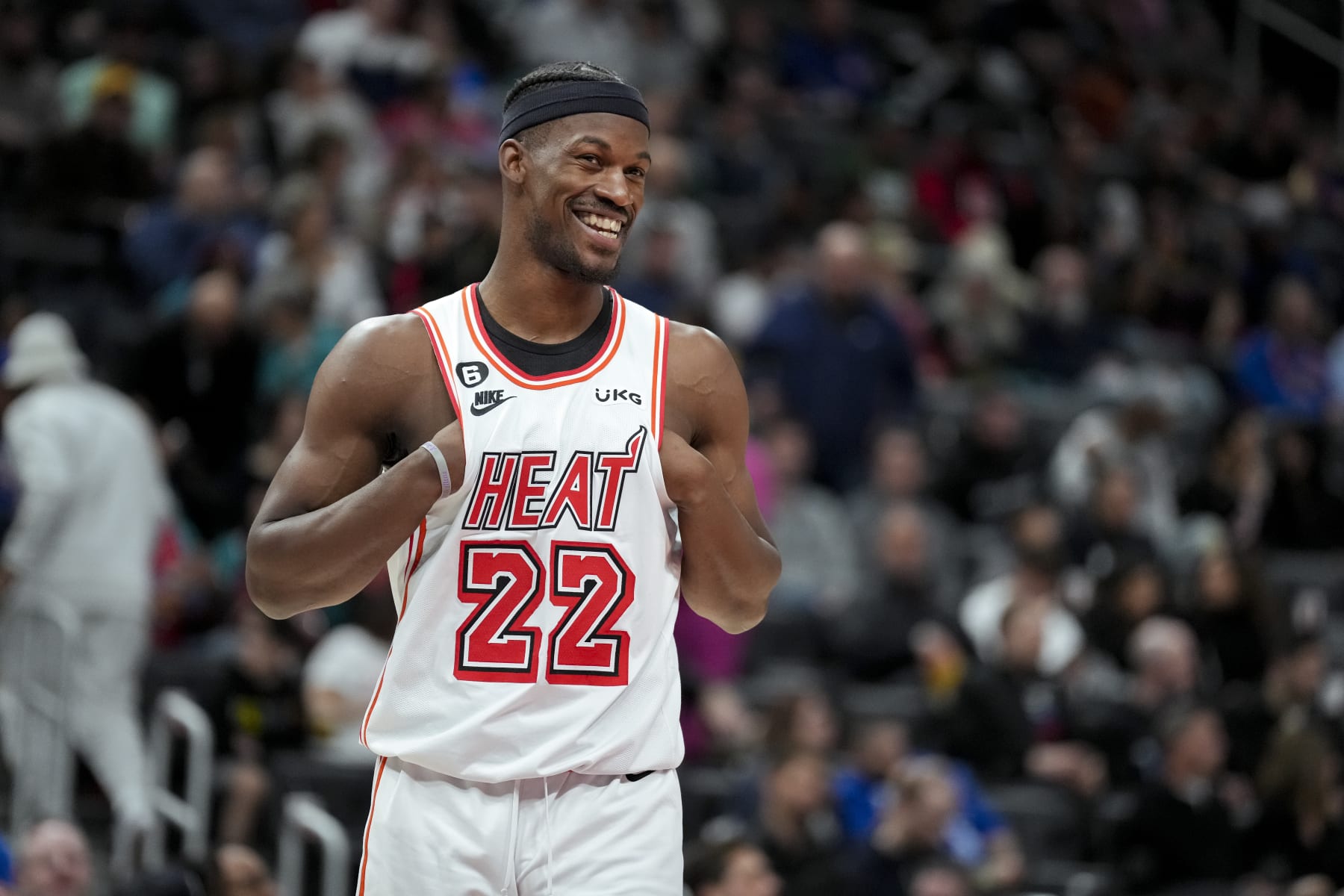 DETROIT, MICHIGAN - APRIL 04: Jimmy Butler #22 of the Miami Heat smiles and looks on against the Detroit Pistons at Little Caesars Arena on April 04, 2023 in Detroit, Michigan. NOTE TO USER: User expressly acknowledges and agrees that, by downloading and or using this photograph, User is consenting to the terms and conditions of the Getty Images License Agreement. (Photo by Nic Antaya/Getty Images)