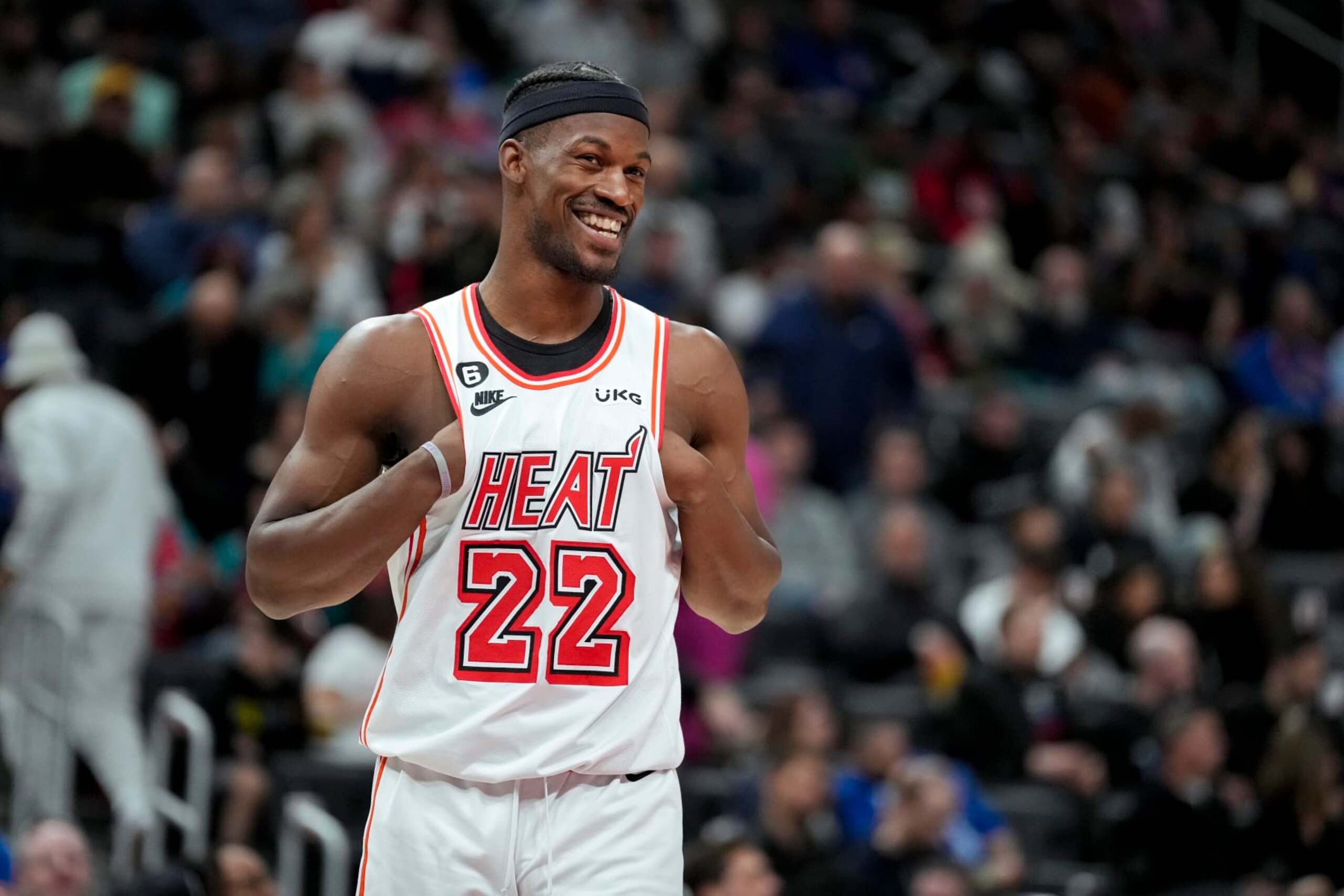 DETROIT, MICHIGAN - APRIL 04: Jimmy Butler #22 of the Miami Heat smiles and looks on against the Detroit Pistons at Little Caesars Arena on April 04, 2023 in Detroit, Michigan. NOTE TO USER: User expressly acknowledges and agrees that, by downloading and or using this photograph, User is consenting to the terms and conditions of the Getty Images License Agreement. (Photo by Nic Antaya/Getty Images)