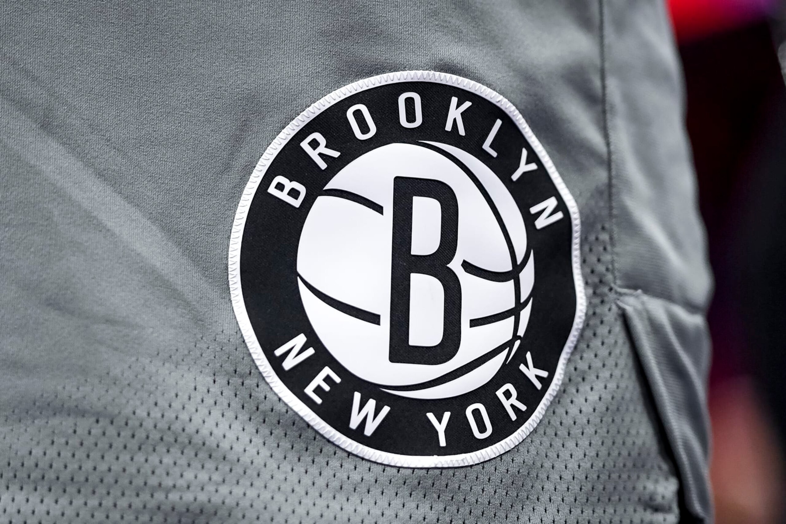 DETROIT, MICHIGAN - DECEMBER 12: The Brooklyn Nets logo is pictured during the second quarter against the Detroit Pistons at Little Caesars Arena on December 12, 2021 in Detroit, Michigan. NOTE TO USER: User expressly acknowledges and agrees that, by downloading and or using this photograph, User is consenting to the terms and conditions of the Getty Images License Agreement. (Photo by Nic Antaya/Getty Images)