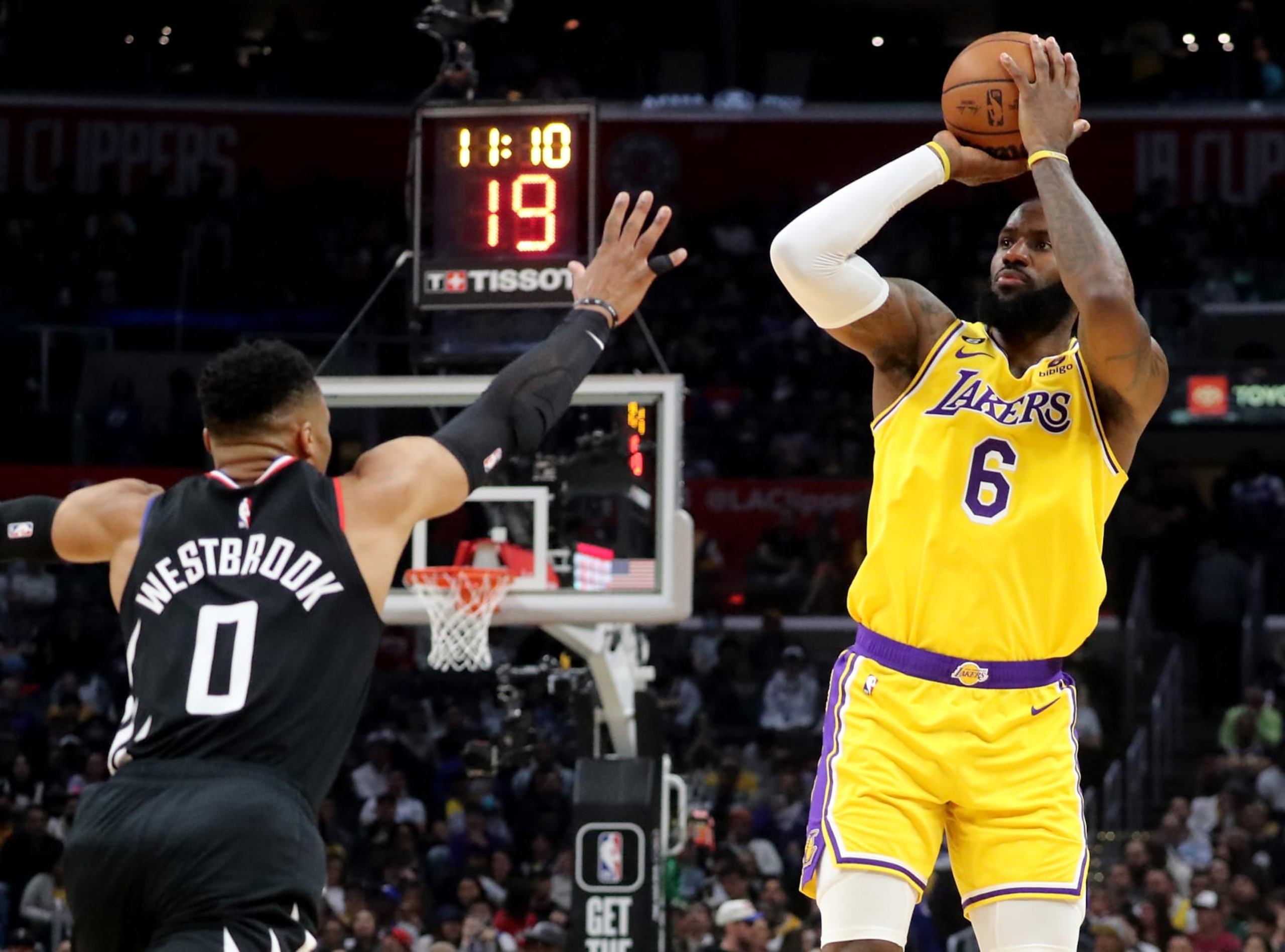Los Angeles, CA - April 05: Lakersforward LeBron James shoots and scores over Clippers guard Russell Westbrook in the third quarter Tuesday night, Apr. 5, 2023, at Crypto.com Arena. (Luis Sinco / Los Angeles Times via Getty Images)