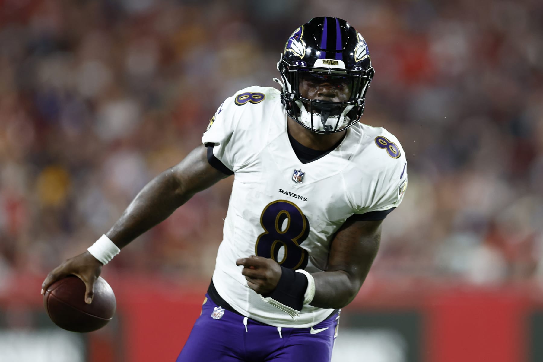 TAMPA, FLORIDA - OCTOBER 27: Lamar Jackson #8 of the Baltimore Ravens carries the ball against the Tampa Bay Buccaneers during the fourth quarter at Raymond James Stadium on October 27, 2022 in Tampa, Florida. (Photo by Douglas P. DeFelice/Getty Images)