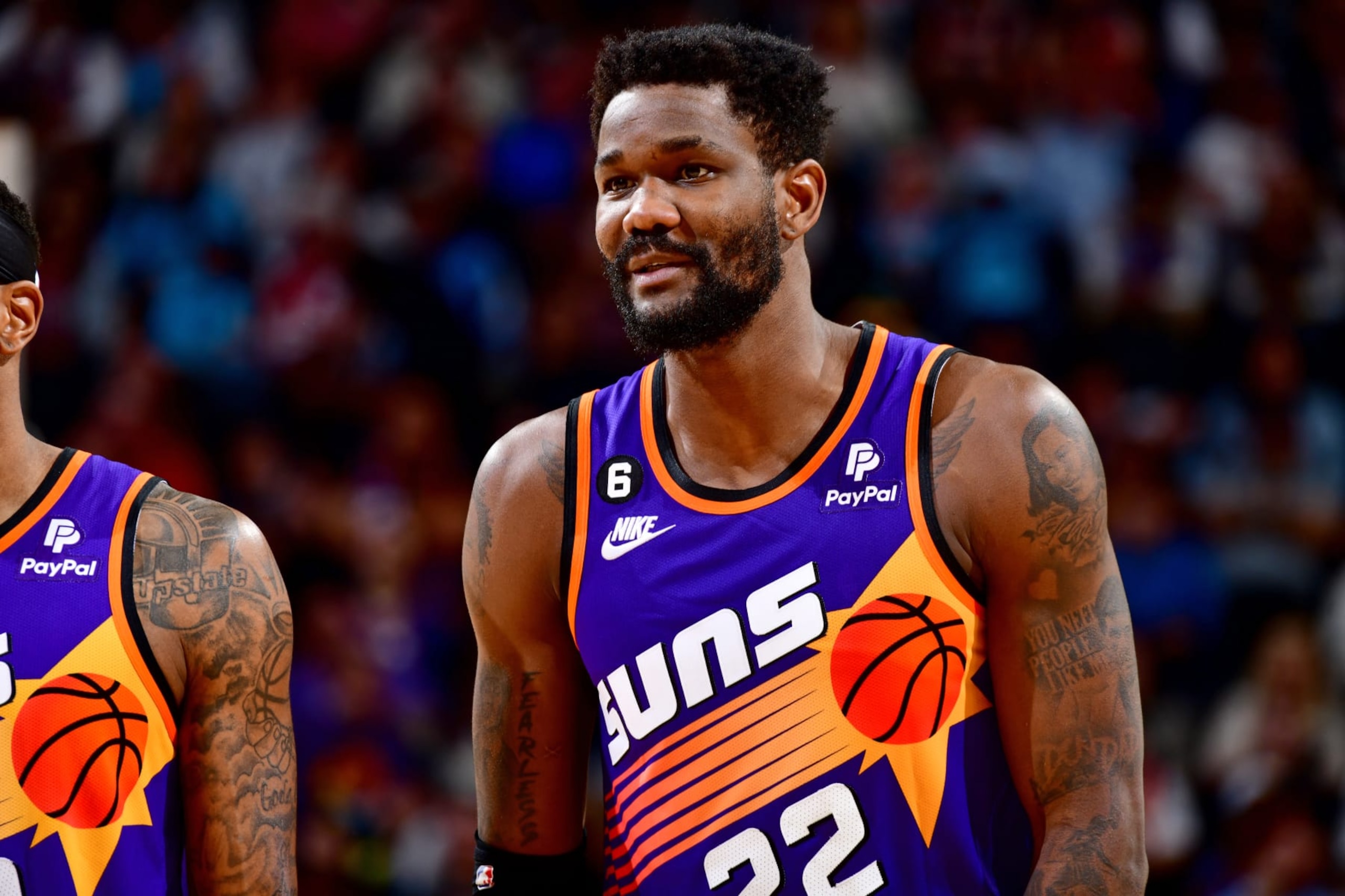PHOENIX, AZ - MARCH 31: Deandre Ayton #22 of the Phoenix Suns smiles during the game against the Denver Nuggets on March 31, 2022 at Footprint Center in Phoenix, Arizona. NOTE TO USER: User expressly acknowledges and agrees that, by downloading and or using this photograph, user is consenting to the terms and conditions of the Getty Images License Agreement. Mandatory Copyright Notice: Copyright 2022 NBAE (Photo by Barry Gossage/NBAE via Getty Images) PHOENIX, AZ - MARCH 31: Deandre Ayton #22 of the Phoenix Suns smiles during the game against the Denver Nuggets on March 31, 2022 at Footprint Center in Phoenix, Arizona. NOTE TO USER: User expressly acknowledges and agrees that, by downloading and or using this photograph, user is consenting to the terms and conditions of the Getty Images License Agreement. Mandatory Copyright Notice: Copyright 2022 NBAE (Photo by Barry Gossage/NBAE via Getty Images)