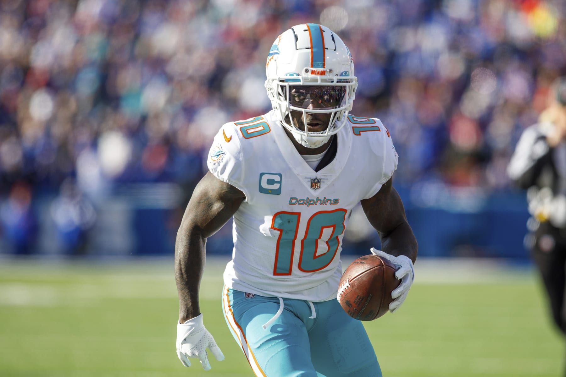 Miami Dolphins wide receiver Tyreek Hill (10) goes out of bounds after a catch during an NFL wild-card football game Sunday, Jan. 15, 2023, in Orchard Park, NY. (AP Photo/Matt Durisko)