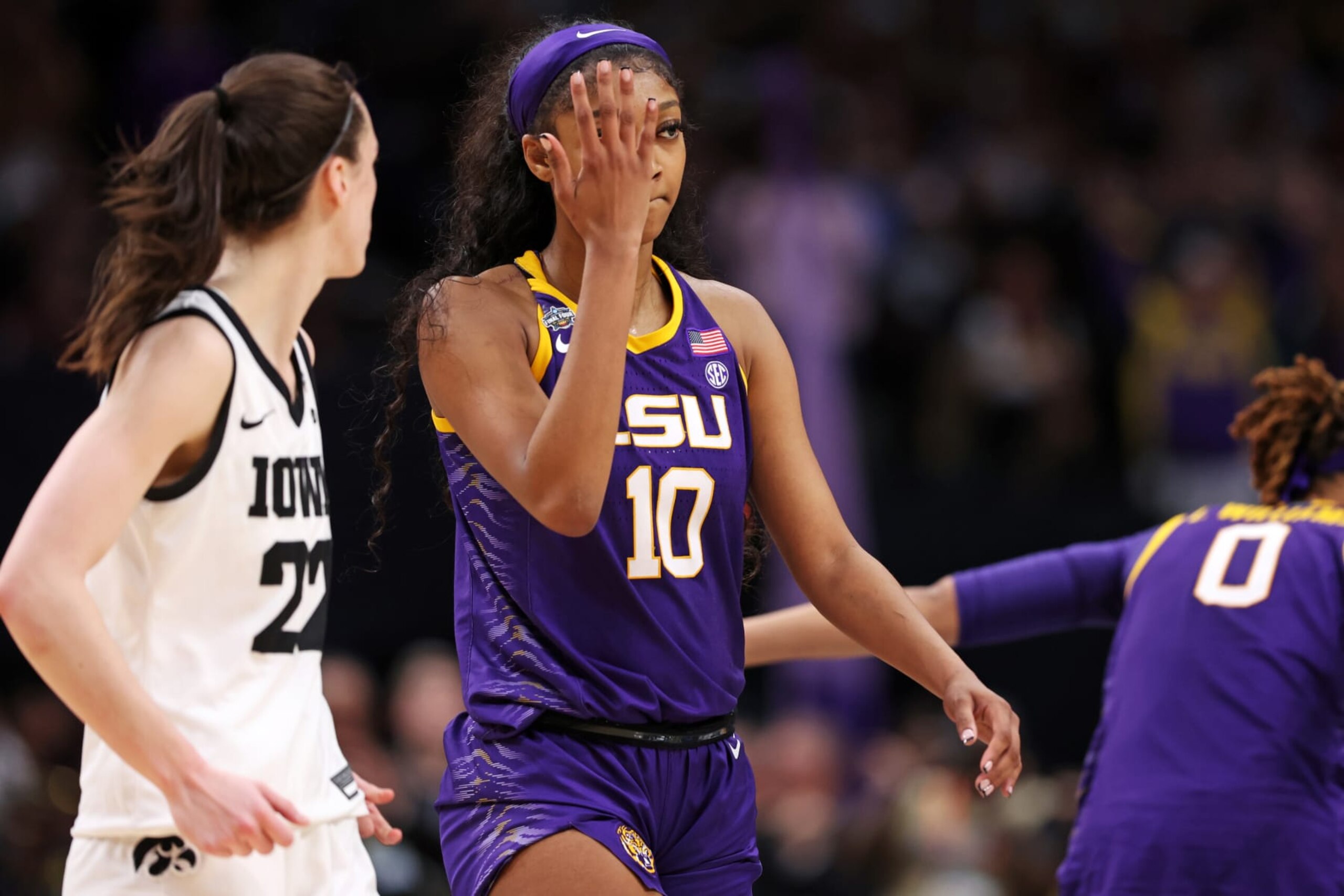 DALLAS, TEXAS - APRIL 02: Angel Reese #10 of the LSU Lady Tigers reacts towards Caitlin Clark #22 of the Iowa Hawkeyes during the fourth quarter during the 2023 NCAA Women's Basketball Tournament championship game at American Airlines Center on April 02, 2023 in Dallas, Texas. (Photo by Maddie Meyer/Getty Images) DALLAS, TEXAS - APRIL 02: Angel Reese #10 of the LSU Lady Tigers reacts towards Caitlin Clark #22 of the Iowa Hawkeyes during the fourth quarter during the 2023 NCAA Women's Basketball Tournament championship game at American Airlines Center on April 02, 2023 in Dallas, Texas. (Photo by Maddie Meyer/Getty Images)