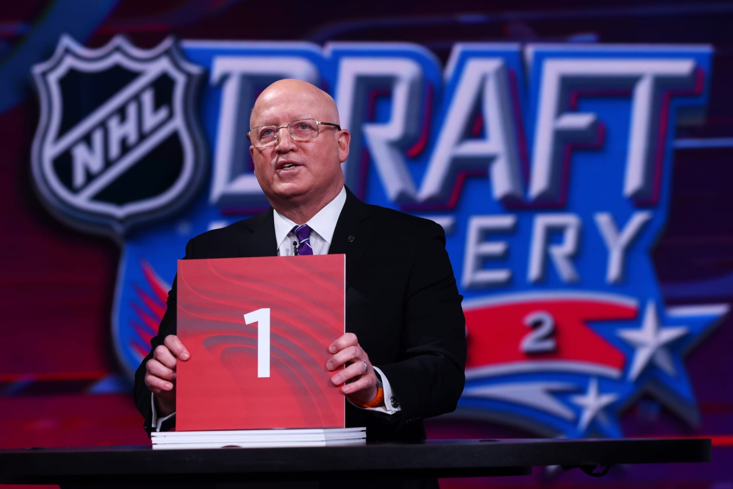 SECAUCUS, NEW JERSEY - MAY 10: National Hockey League Deputy Commissioner Bill Daly announces draft position during the 2022 NHL Draft Lottery on May 10, 2022 at the NHL Network's studio in Secaucus, New Jersey. (Photo by Mike Stobe/NHLI via Getty Images)