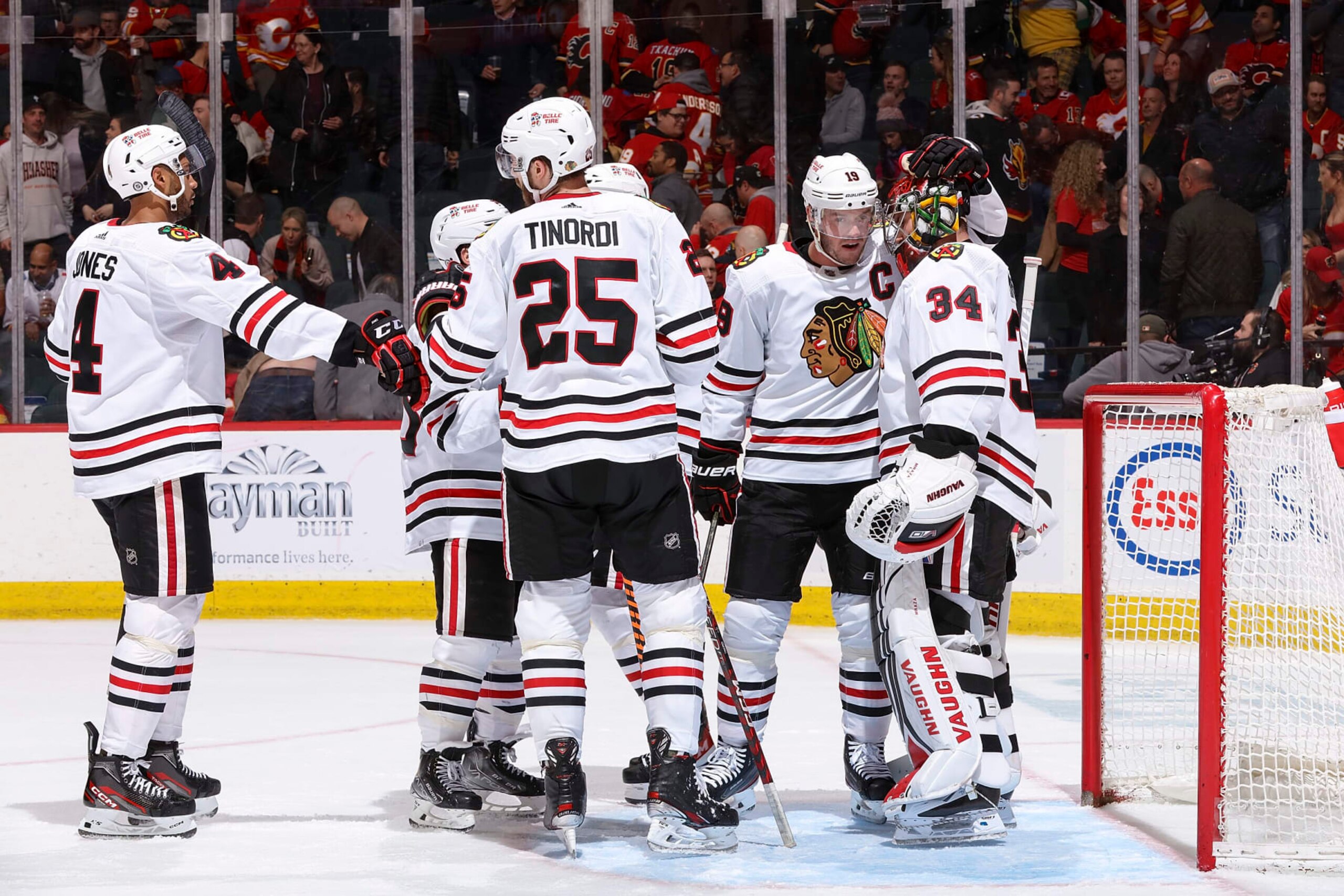 CALGARY, AB - APRIL 4: The Chicago Blackhawks celebrate on ice after a win against the Calgary Flames at Scotiabank Saddledome on April 4, 2023 in Calgary, Alberta, Canada. (Photo by Gerry Thomas/NHLI via Getty Images)