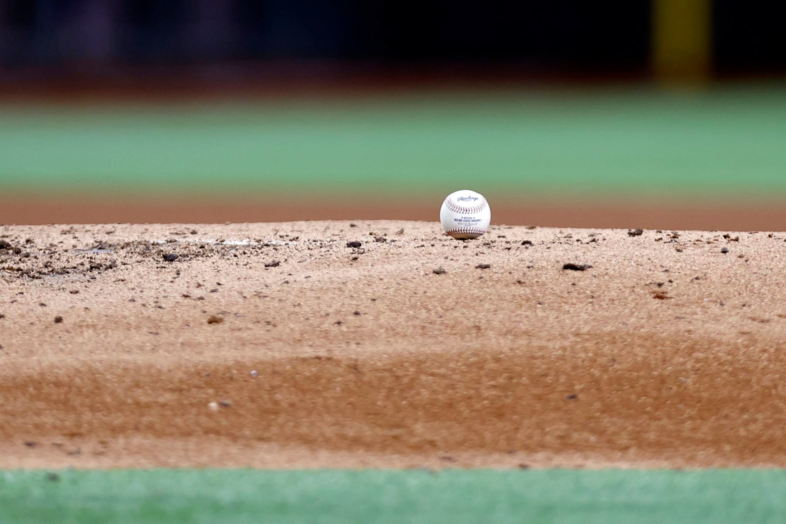ARLINGTON, TEXAS - APRIL 04: A general view of a baseball on the mound during the game between the Texas Rangers and the Baltimore Orioles at Globe Life Field on April 04, 2023 in Arlington, Texas. (Photo by Tim Heitman/Getty Images) ARLINGTON, TEXAS - APRIL 04: A general view of a baseball on the mound during the game between the Texas Rangers and the Baltimore Orioles at Globe Life Field on April 04, 2023 in Arlington, Texas. (Photo by Tim Heitman/Getty Images)