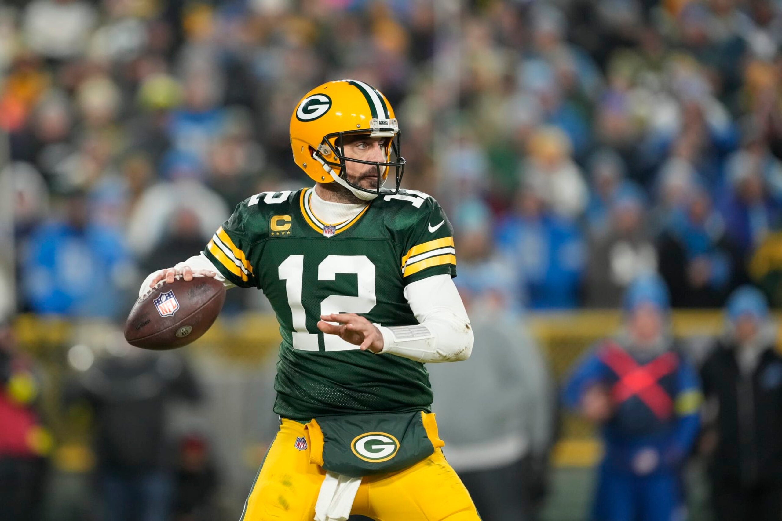 GREEN BAY, WISCONSIN - JANUARY 08: Aaron Rodgers #12 of the Green Bay Packers looks to the throw the pass against the Detroit Lions in the second half at Lambeau Field on January 08, 2023 in Green Bay, Wisconsin. (Photo by Patrick McDermott/Getty Images) GREEN BAY, WISCONSIN - JANUARY 08: Aaron Rodgers #12 of the Green Bay Packers looks to the throw the pass against the Detroit Lions in the second half at Lambeau Field on January 08, 2023 in Green Bay, Wisconsin. (Photo by Patrick McDermott/Getty Images)