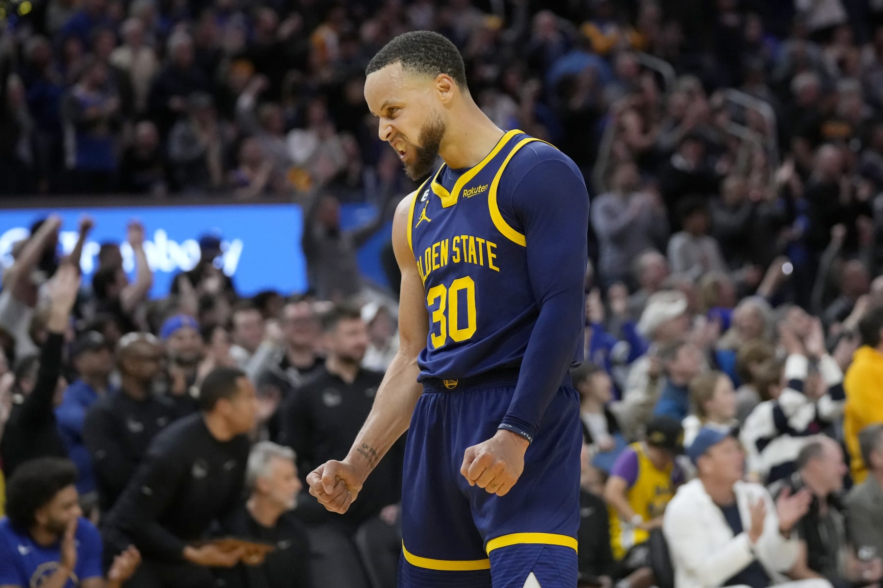 Golden State Warriors guard Stephen Curry celebrates during the second half of the team's NBA basketball game against the Oklahoma City Thunder in San Francisco, Tuesday, April 4, 2023. (AP Photo/Jeff Chiu)