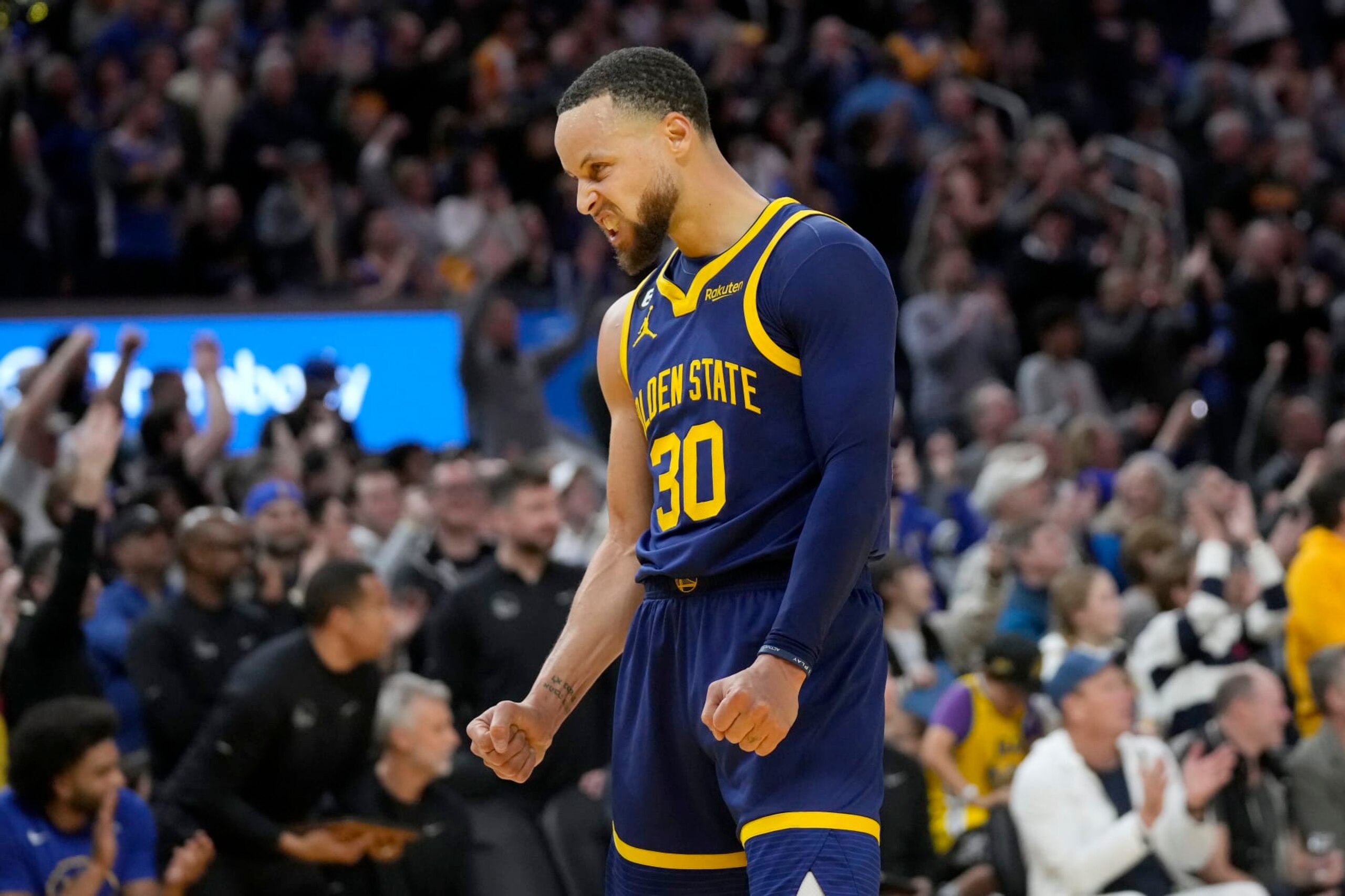 Golden State Warriors guard Stephen Curry celebrates during the second half of the team's NBA basketball game against the Oklahoma City Thunder in San Francisco, Tuesday, April 4, 2023. (AP Photo/Jeff Chiu)
