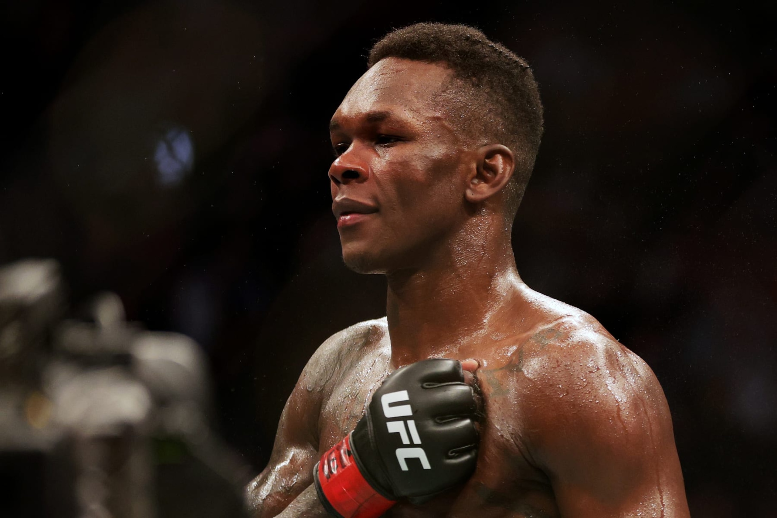 HOUSTON, TEXAS - FEBRUARY 12: Israel Adesanya of Nigeria celebrates after defending his middleweight championship against Robert Whittaker of Australia during UFC 271 at Toyota Center on February 12, 2022 in Houston, Texas. Adesanya won by unanimous decision. (Photo by Carmen Mandato/Getty Images)