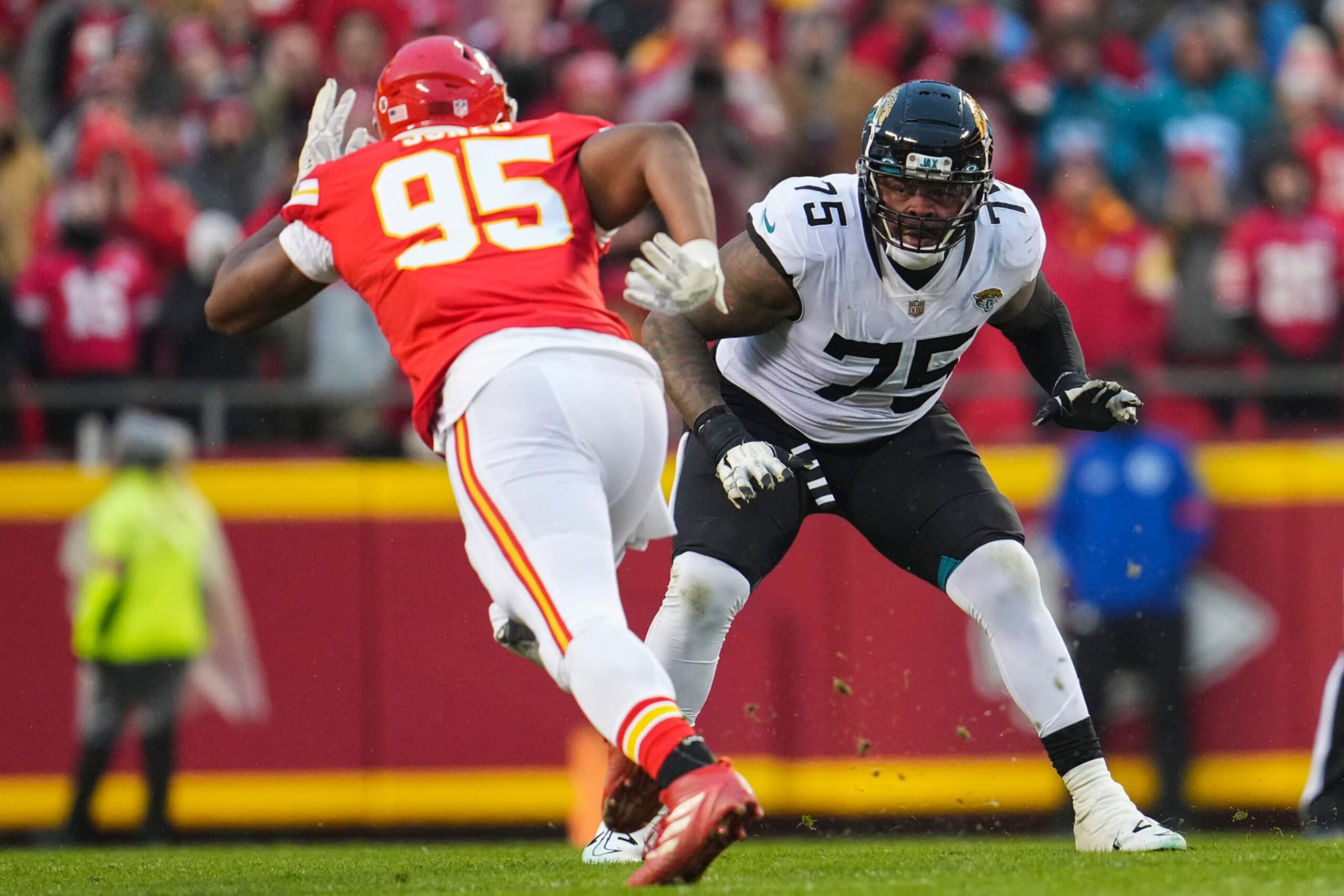 KANSAS CITY, MO - JANUARY 21: Jawaan Taylor #75 of the Jacksonville Jaguars defends against the Kansas City Chiefs at GEHA Field at Arrowhead Stadium on January 21, 2023 in Kansas City, Missouri. (Photo by Cooper Neill/Getty Images)