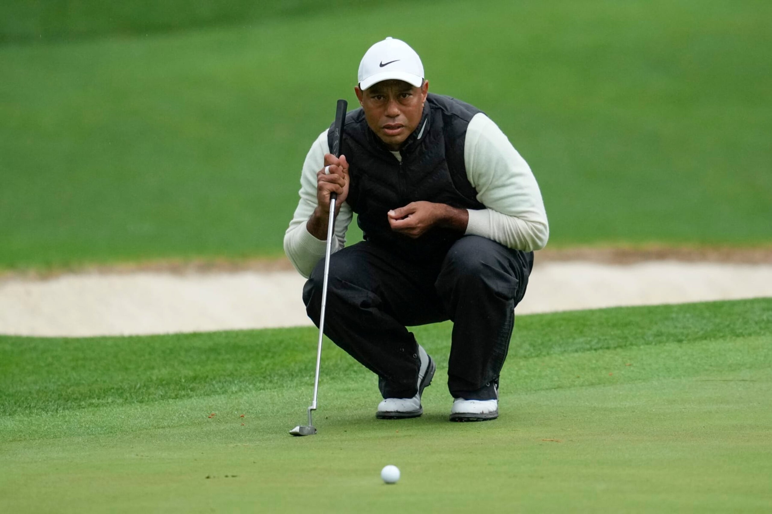 Tiger Woods lines up a putt on the 16th hole during the weather delayed second round of the Masters golf tournament at Augusta National Golf Club on Saturday, April 8, 2023, in Augusta, Ga. (AP Photo/Mark Baker) Tiger Woods lines up a putt on the 16th hole during the weather delayed second round of the Masters golf tournament at Augusta National Golf Club on Saturday, April 8, 2023, in Augusta, Ga. (AP Photo/Mark Baker)