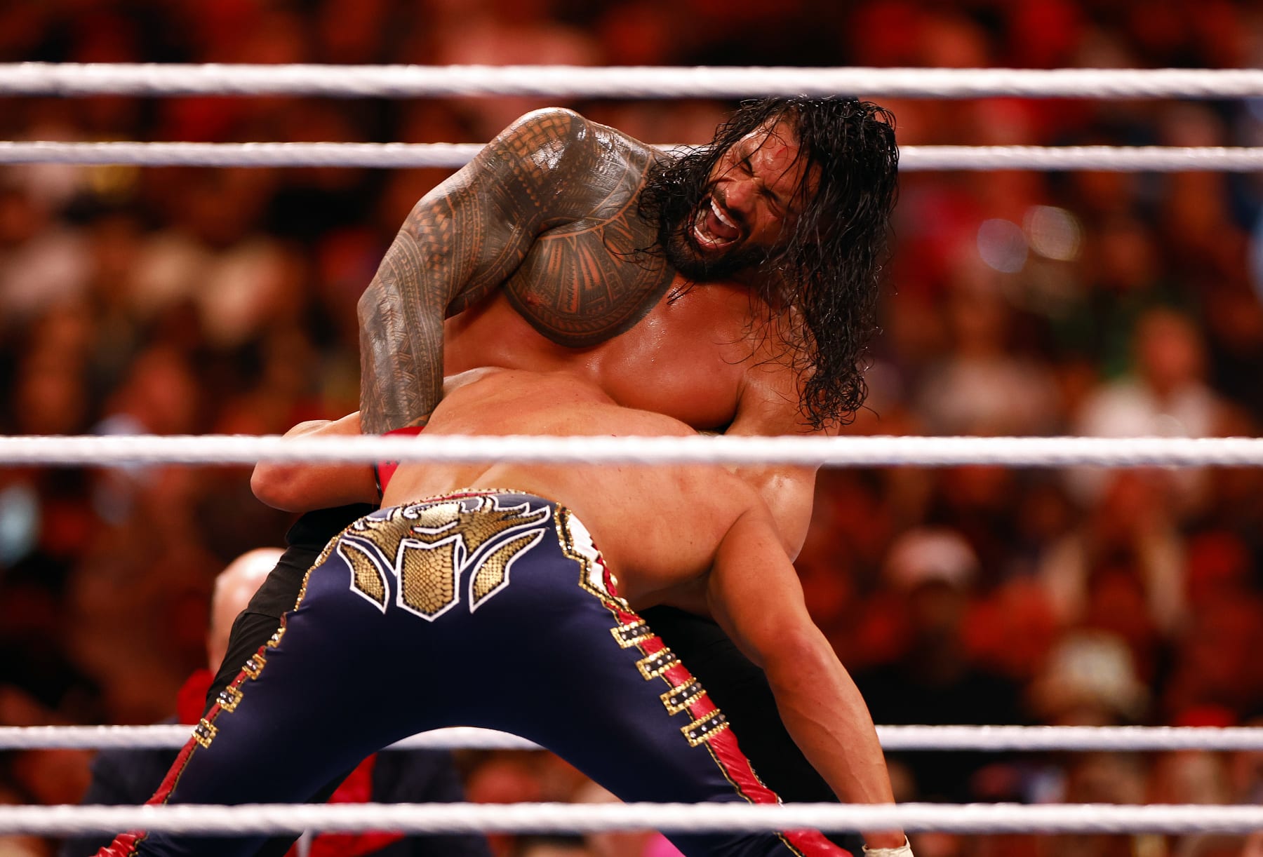 INGLEWOOD, CALIFORNIA - APRIL 02:  (L-R) Roman Reigns wrestles Cody Rhodes for Undisputed WWE Universal Title Match during WrestleMania Goes Hollywood at SoFi Stadium on April 02, 2023 in Inglewood, California.  (Photo by Ronald Martinez/Getty Images)
