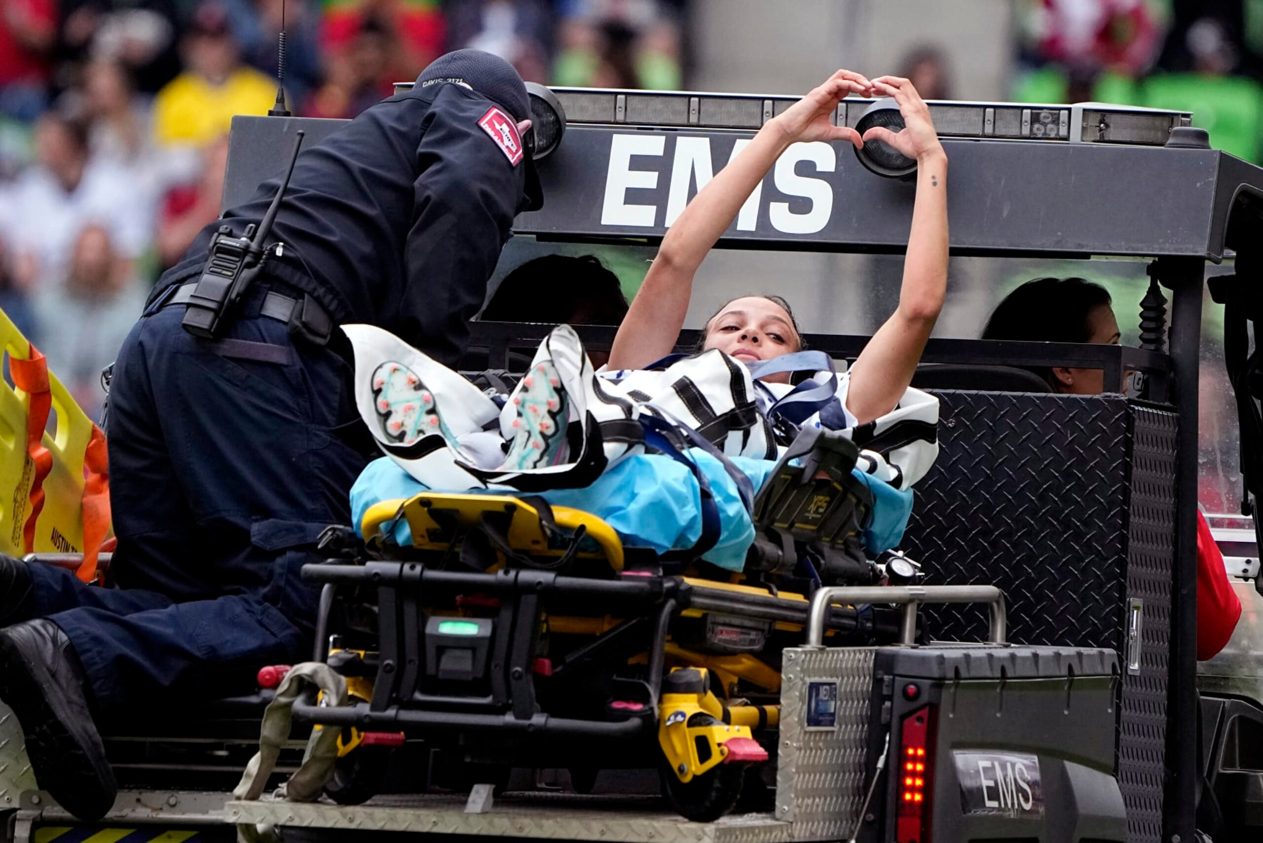 United States forward Mallory Swanson signals to fans as she is taken off the field after an injury during the first half of an international friendly soccer match against Ireland in Austin, Texas, Saturday, April 8, 2023. (AP Photo/Eric Gay)