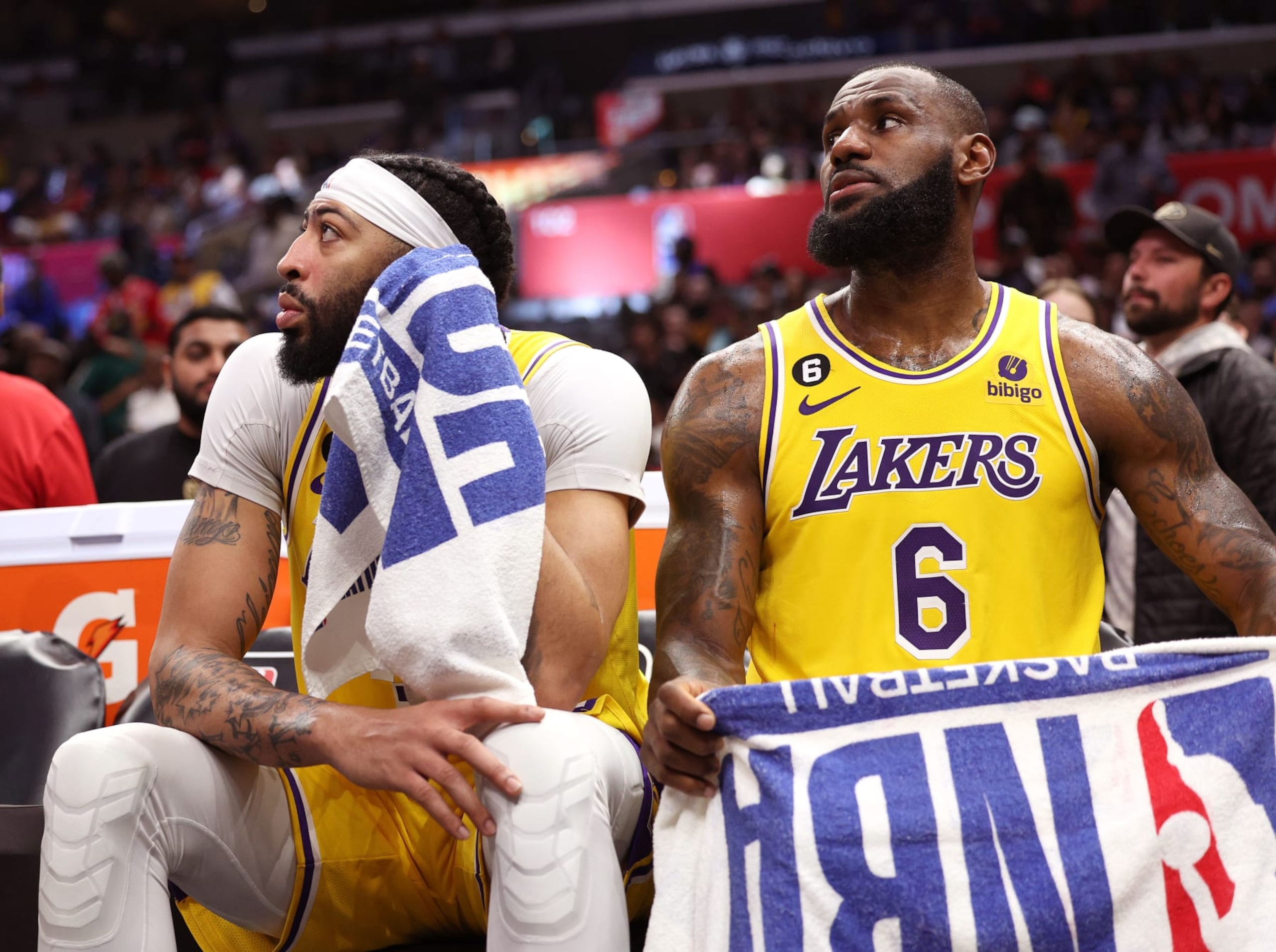 LOS ANGELES, CALIFORNIA - APRIL 05: Anthony Davis #3 and LeBron James #6 of the Los Angeles Lakers react from the bench during a 125-118 LA Clippers win at Crypto.com Arena on April 05, 2023 in Los Angeles, California. NOTE TO USER: User expressly acknowledges and agrees that, by downloading and or using this photograph, User is consenting to the terms and conditions of the Getty Images License Agreement. (Photo by Harry How/Getty Images)