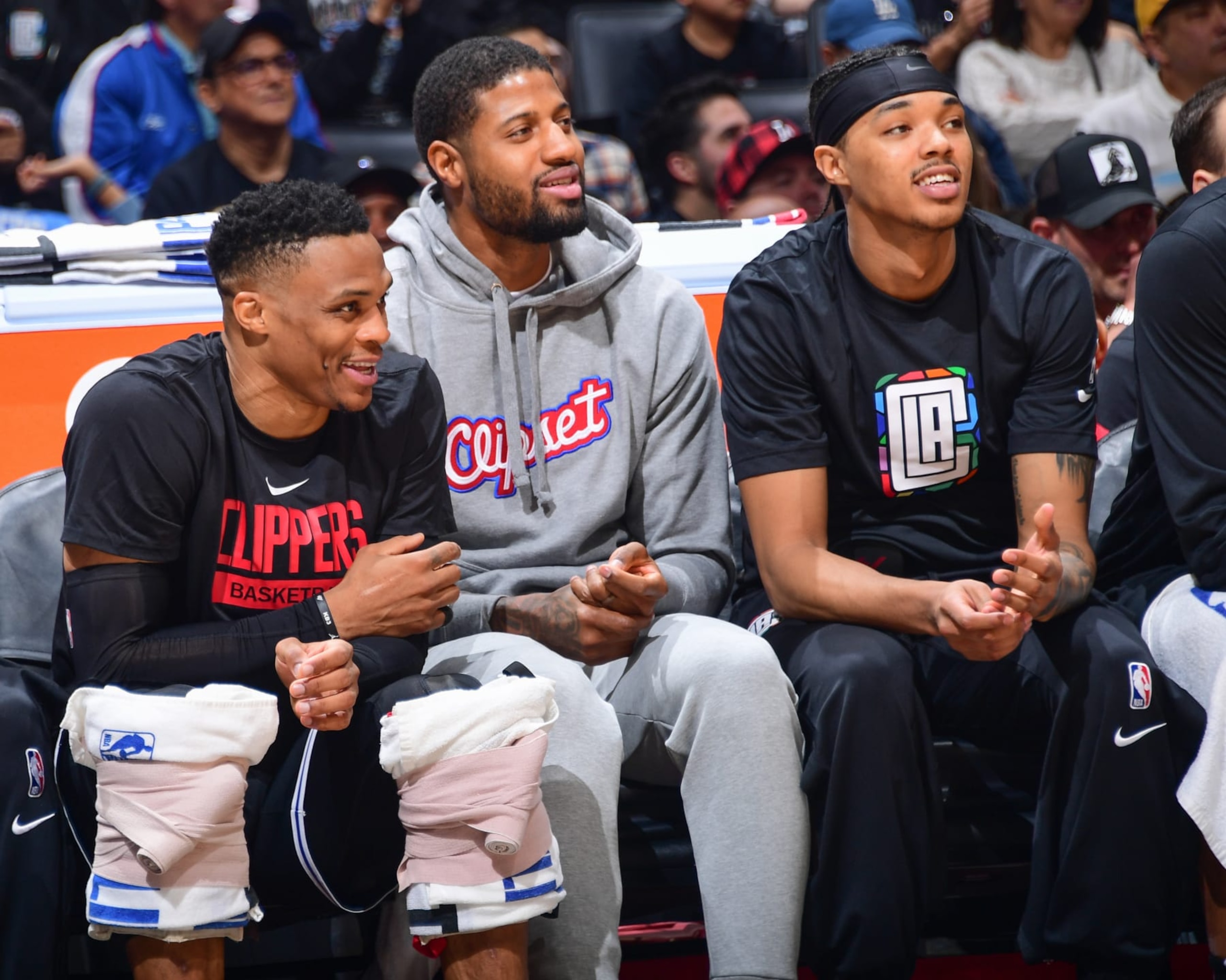 LOS ANGELES, CA - APRIL 8:  Brandon Boston Jr. #4, Paul George #13 and Russell Westbrook #0 of the LA Clippers sit courtside during the game on April 8, 2023 at Crypto.Com Arena in Los Angeles, California. NOTE TO USER: User expressly acknowledges and agrees that, by downloading and/or using this Photograph, user is consenting to the terms and conditions of the Getty Images License Agreement. Mandatory Copyright Notice: Copyright 2023 NBAE (Photo by Adam Pantozzi/NBAE via Getty Images)