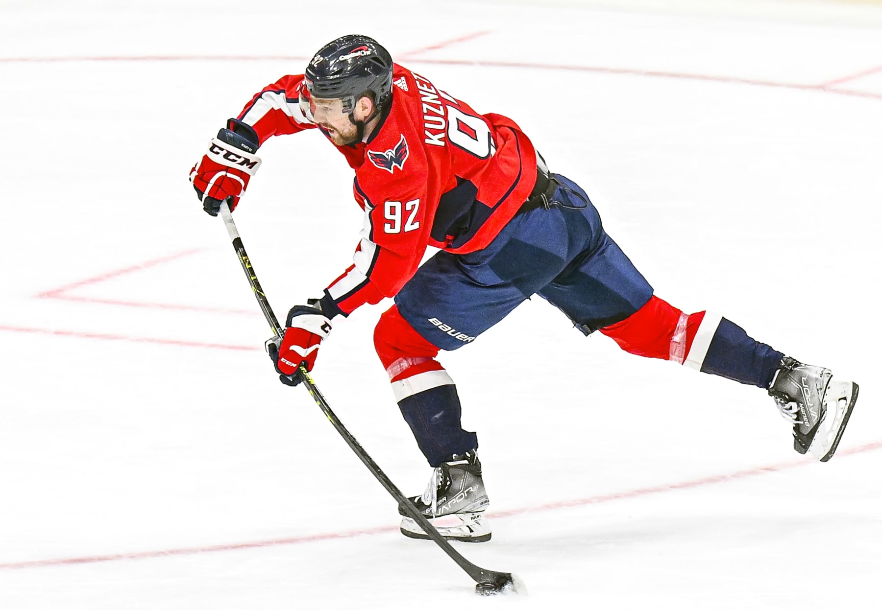 WASHINGTON, DC - MARCH 21: Washington Capitals center Evgeny Kuznetsov (92) fires a shot during the Columbus Blue Jackets game versus the Washington Capitals on March 21, 2023 at the Capital One Arena in Washington, D.C.   (Photo by Mark Goldman/Icon Sportswire via Getty Images)