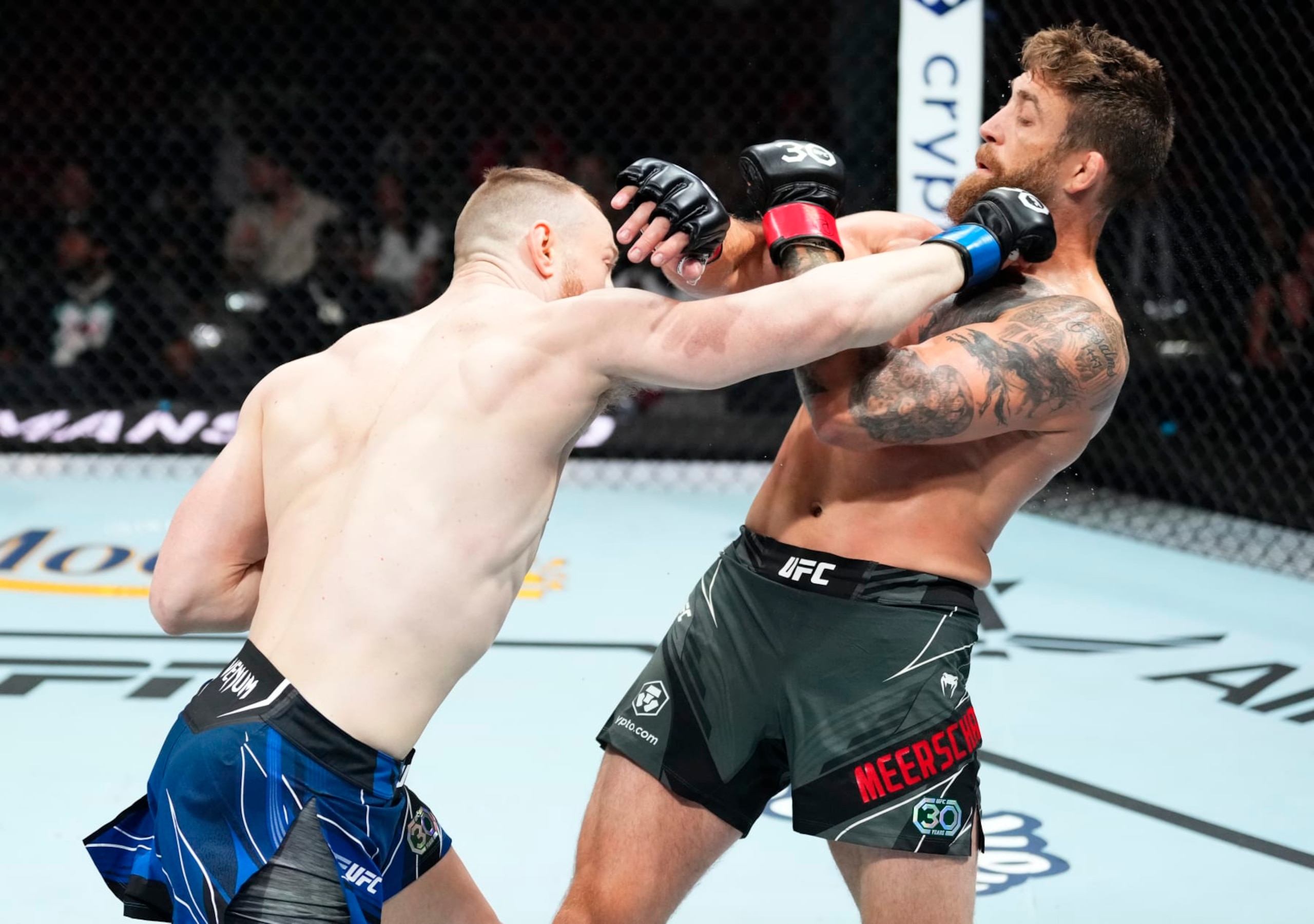 MIAMI, FLORIDA - APRIL 08: (L-R) Joe Pyfer punches Gerald Meerschaert in a middleweight fight during the UFC 287 event at Kaseya Center on April 08, 2023 in Miami, Florida. (Photo by Jeff Bottari/Zuffa LLC via Getty Images)