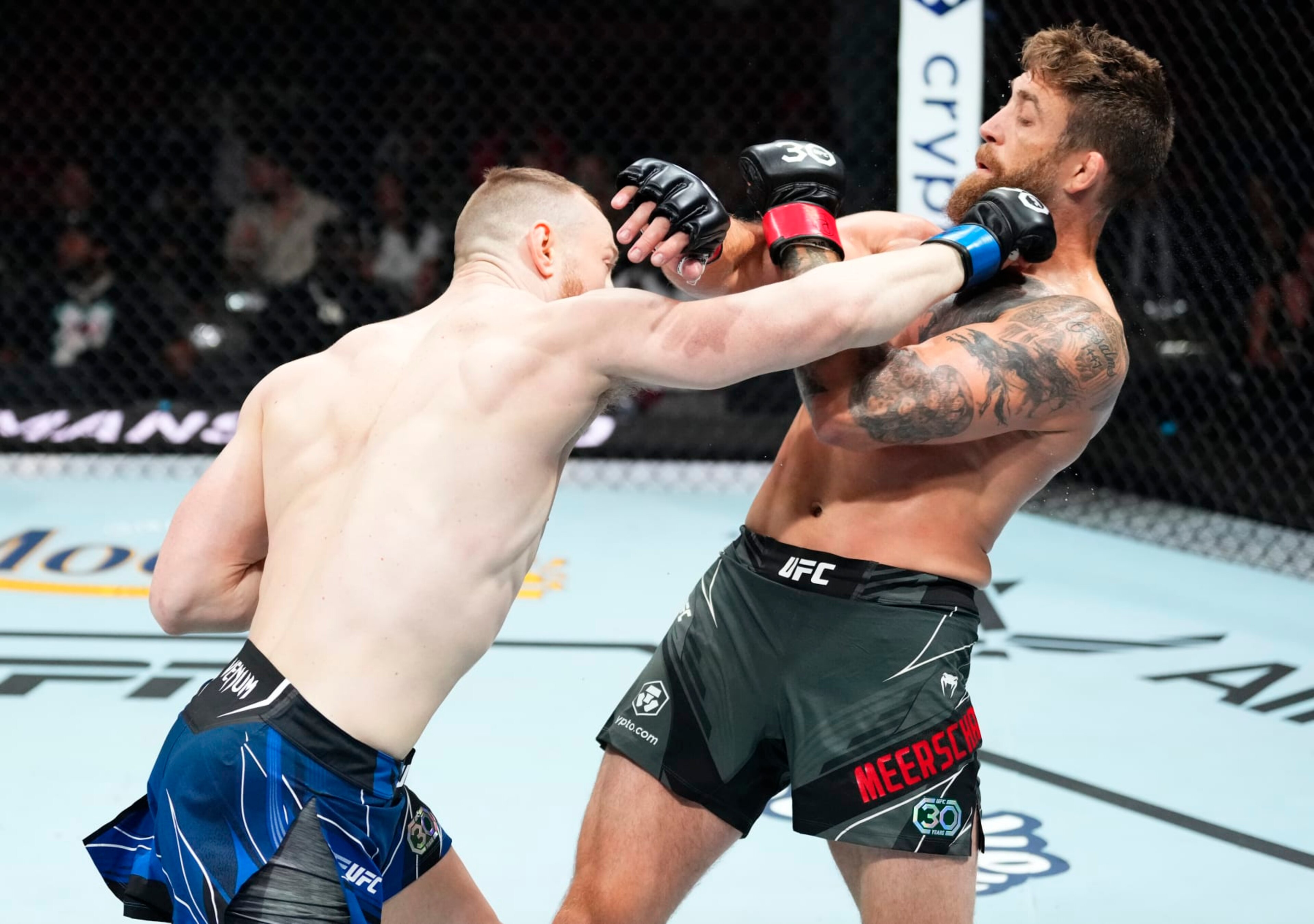 MIAMI, FLORIDA - APRIL 08: (L-R) Joe Pyfer punches Gerald Meerschaert in a middleweight fight during the UFC 287 event at Kaseya Center on April 08, 2023 in Miami, Florida. (Photo by Jeff Bottari/Zuffa LLC via Getty Images)