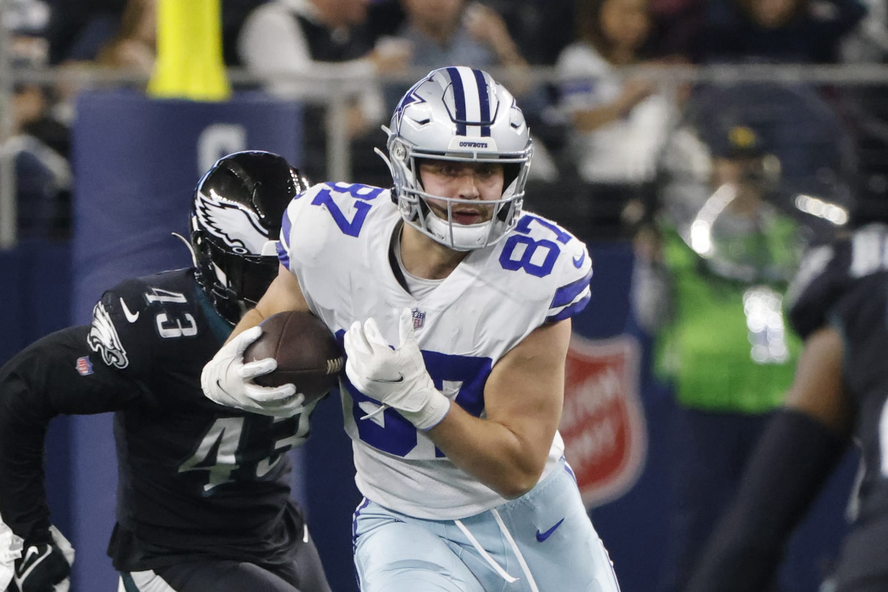 Dallas Cowboys tight end Jake Ferguson (87) runs after a reception against the Philadelphia Eagles during an NFL Football game in Arlington, Texas, Saturday, Dec. 24, 2022. (AP Photo/Michael Ainsworth)