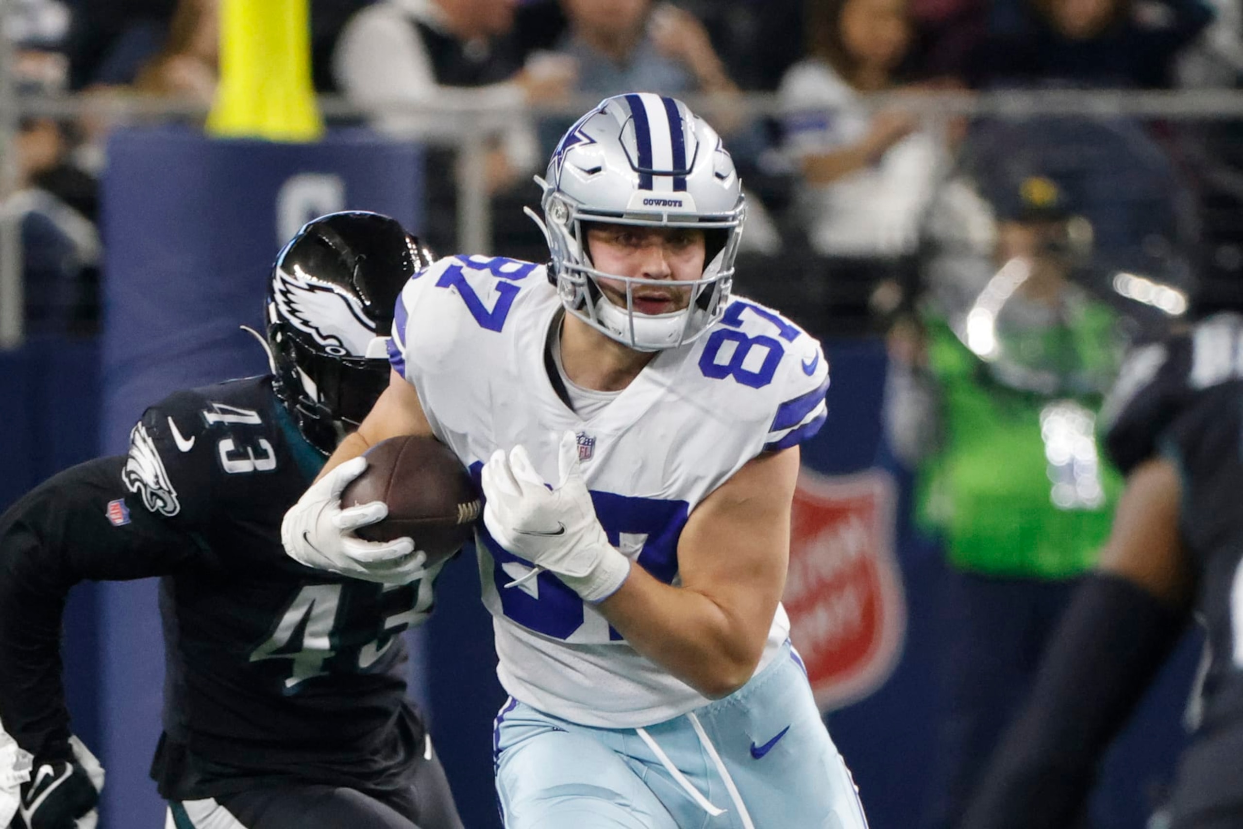 Dallas Cowboys tight end Jake Ferguson (87) runs after a reception against the Philadelphia Eagles during an NFL Football game in Arlington, Texas, Saturday, Dec. 24, 2022. (AP Photo/Michael Ainsworth)