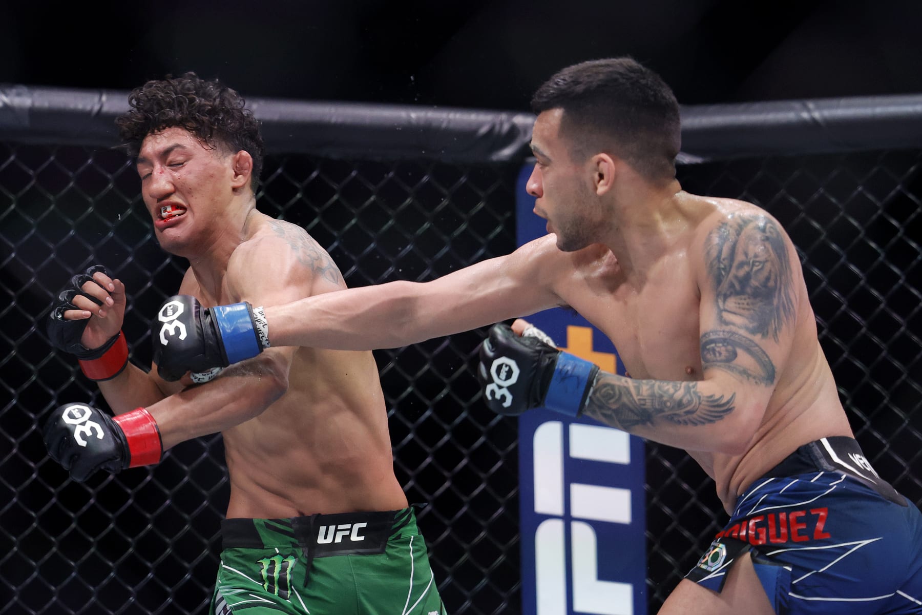 MIAMI, FLORIDA - APRIL 08: Christian Rodriguez (R) punches Raul Rosas Jr. in their bantamweight bout at Kaseya Center on April 08, 2023 in Miami, Florida. (Photo by Carmen Mandato/Getty Images)