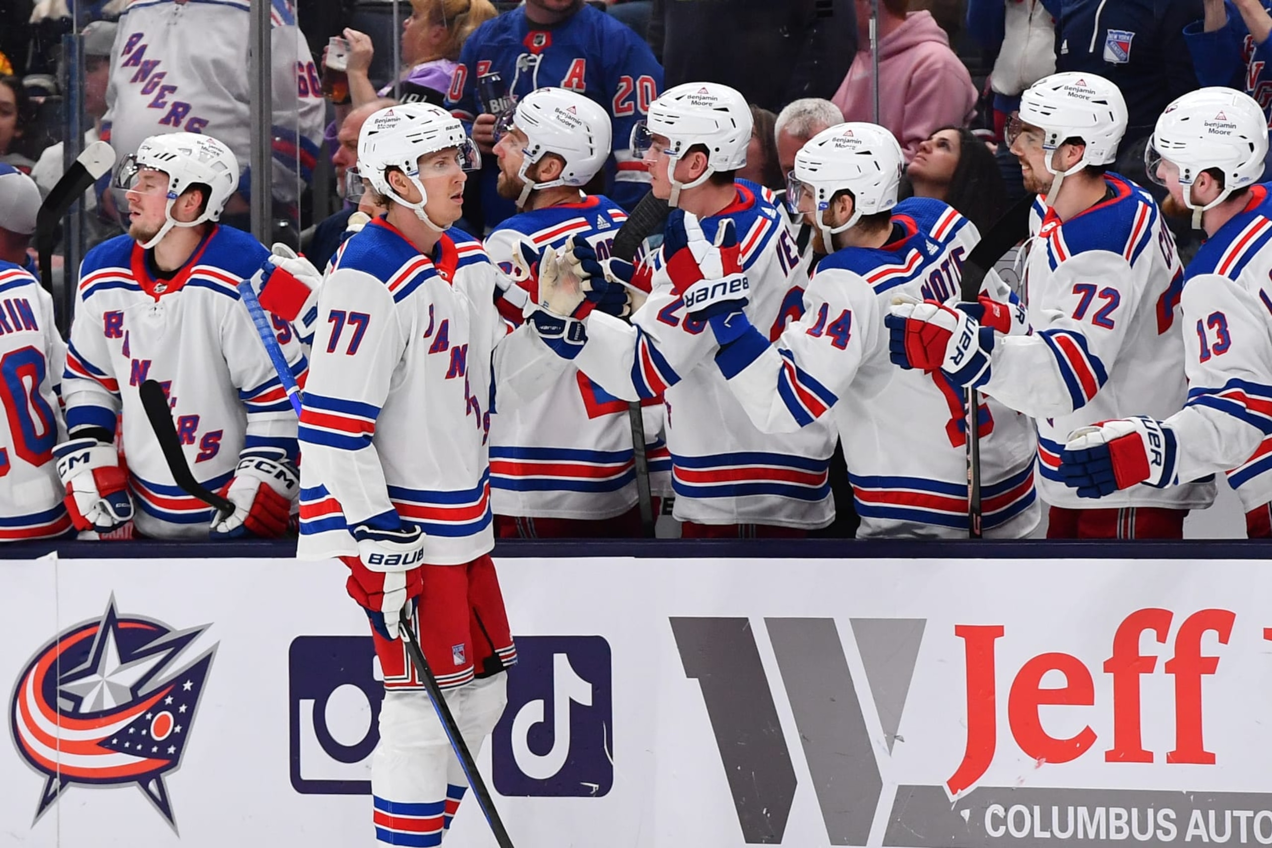 COLUMBUS, OHIO - APRIL 8: Niko Mikkola #77 of the New York Rangers high-fives his teammates after scoring a goal during the third period of a game against the Columbus Blue Jackets at Nationwide Arena on April 8, 2023 in Columbus, Ohio. (Photo by Ben Jackson/NHLI via Getty Images)