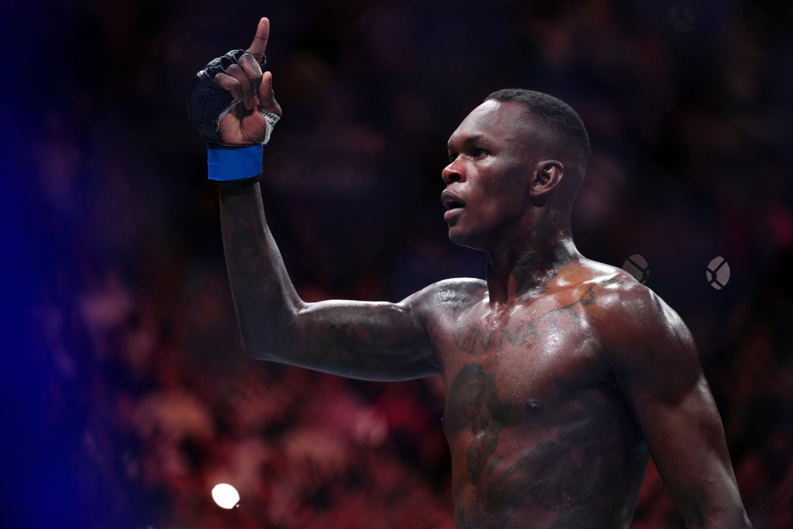 MIAMI, FLORIDA - APRIL 08: Israel Adesanya of Nigeria reacts after knocking out Alex Pereira of Brazil in the UFC middleweight championship fight during the UFC 287 event at Kaseya Center on April 08, 2023 in Miami, Florida. (Photo by Cooper Neill/Zuffa LLC via Getty Images)