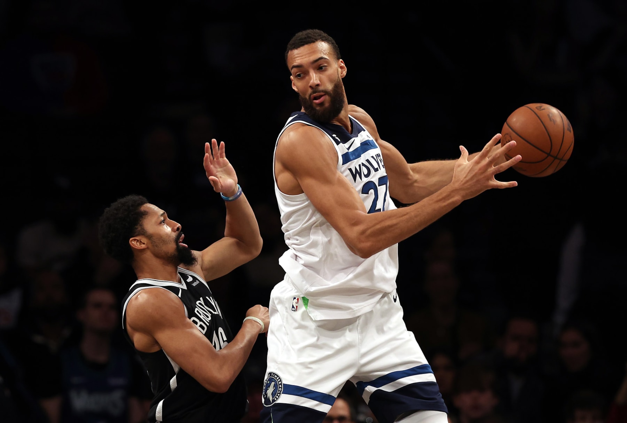 NEW YORK, NEW YORK - APRIL 04:  Rudy Gobert #27 of the Minnesota Timberwolves controls the ball as Spencer Dinwiddie #26 of the Brooklyn Nets defends during the game at Barclays Center on April 04, 2023 in New York City. (Photo by Jamie Squire/Getty Images)