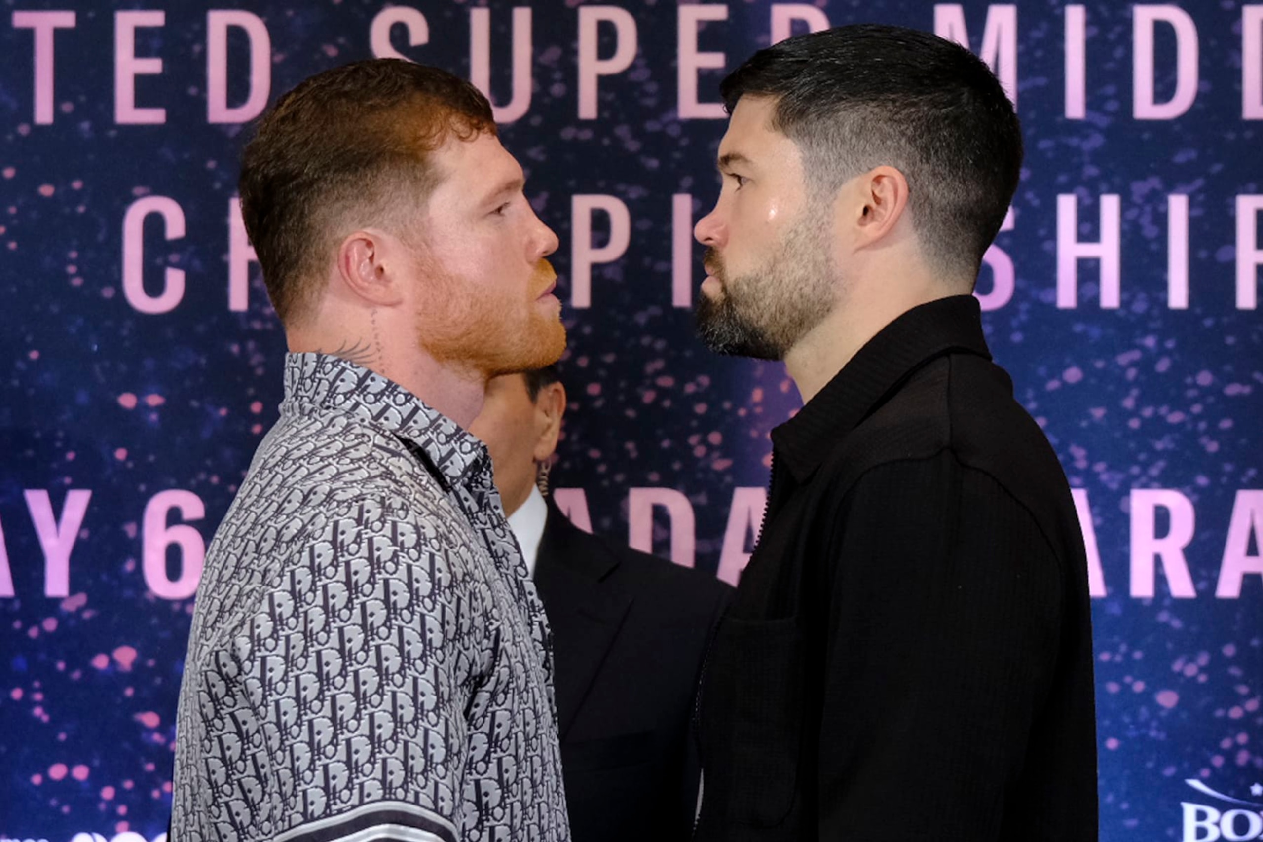 ZAPOPAN, MEXICO - MARCH 14: Saul Canelo Alvarez (L) and John Ryder (R) face off during the press conference at Akron Stadium on March 14, 2023 in Zapopan, Mexico. Canelo Alvarez will fight against John Ryder on May 6, 12 years after his last combat in Mexico. The event will take place at Akron Stadium. (Photo by Alfredo Moya/Jam Media/Getty Images)