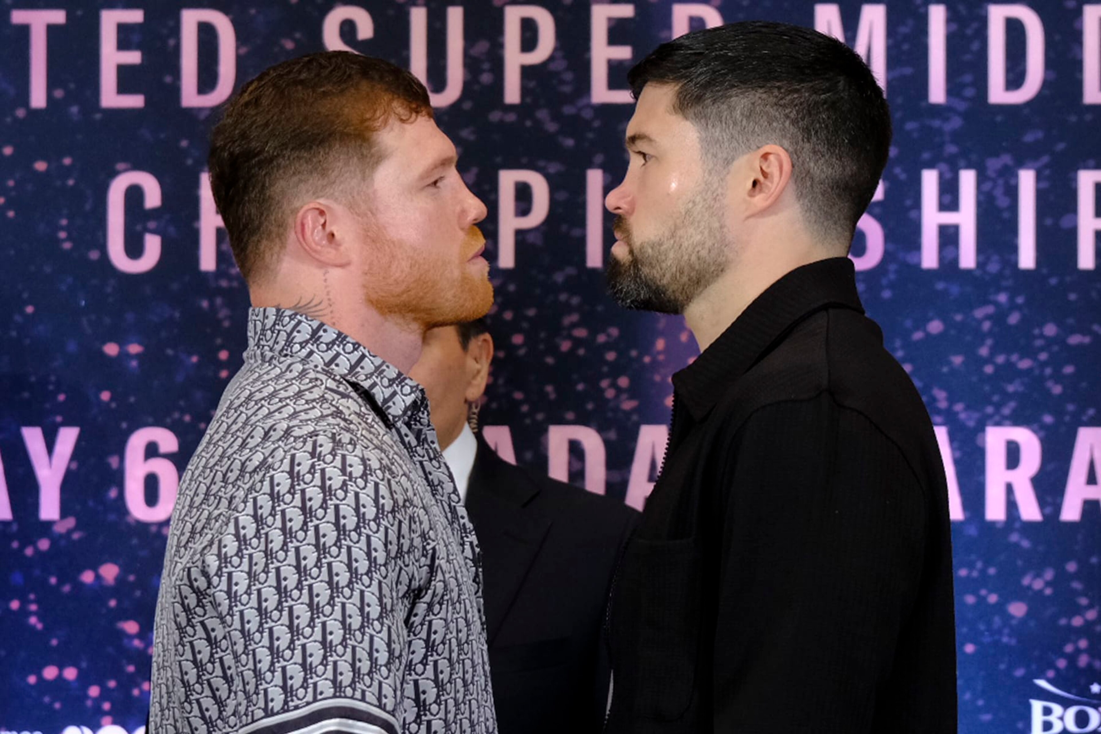 ZAPOPAN, MEXICO - MARCH 14: Saul Canelo Alvarez (L) and John Ryder (R) face off during the press conference at Akron Stadium on March 14, 2023 in Zapopan, Mexico. Canelo Alvarez will fight against John Ryder on May 6, 12 years after his last combat in Mexico. The event will take place at Akron Stadium. (Photo by Alfredo Moya/Jam Media/Getty Images)