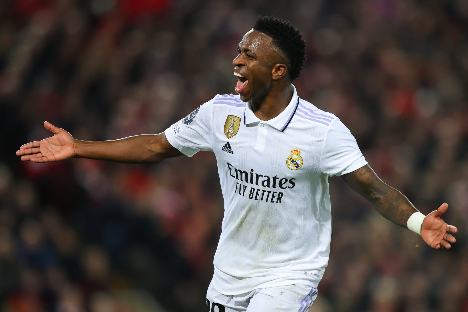 LIVERPOOL, ENGLAND - FEBRUARY 21: Vinicius Junior of Real Madrid celebrates after scoring his side's second goal during the UEFA Champions League round of 16 leg one match between Liverpool FC and Real Madrid at Anfield on February 21, 2023 in Liverpool, England. (Photo by James Gill - Danehouse/Getty Images)