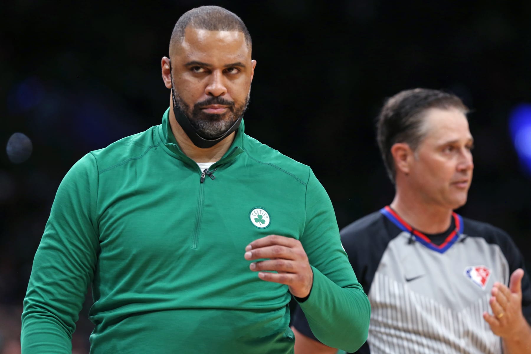 Boston - June 16: Celtics head coach Ime Udoka (left) did not agree with a referee (right) in the second quarter. The Boston Celtics hosted the Golden State Warriors for Game Six of the NBA Finals at the TD Garden in Boston on June 17, 2022. (Photo by Jim Davis/The Boston Globe via Getty Images)