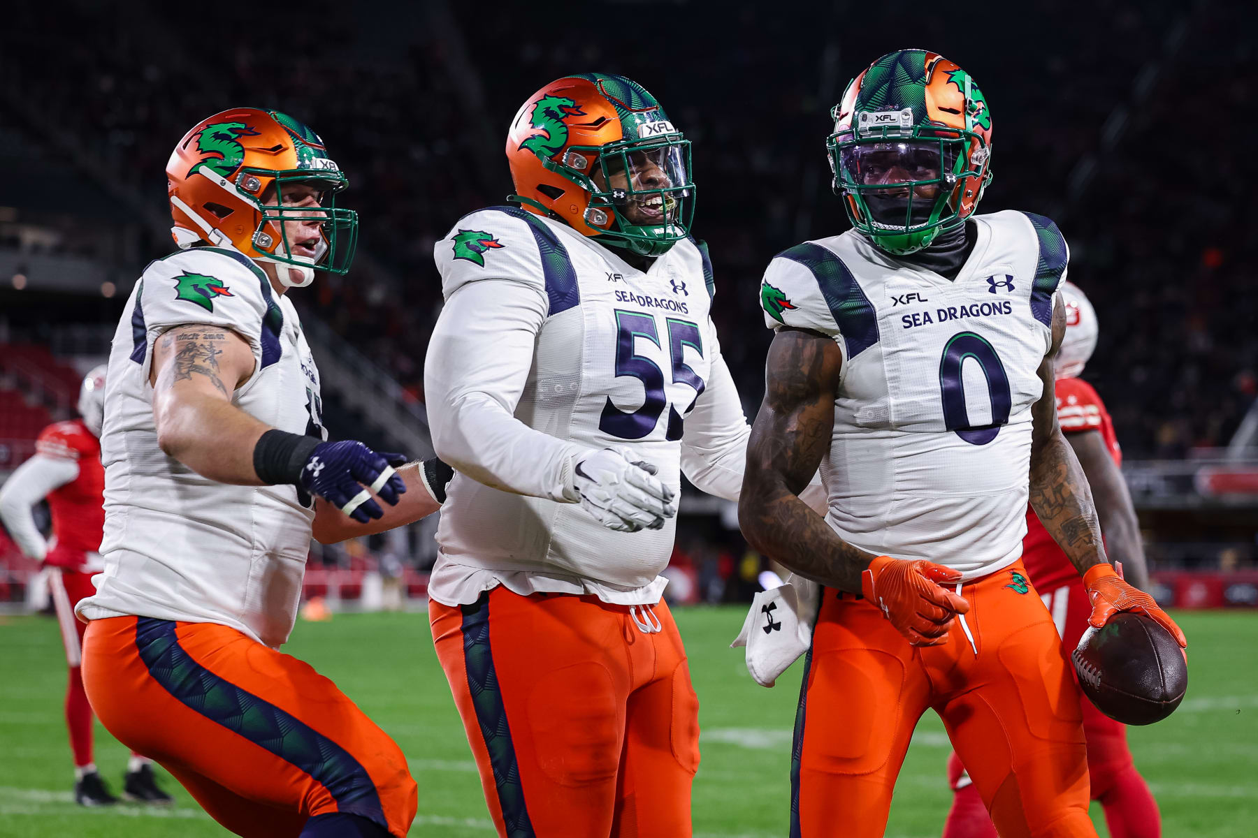 WASHINGTON, DC - FEBRUARY 19: Josh Gordon #0 of the Seattle Sea Dragons celebrates with teammates after catching a pass for a touchdown against the DC Defenders during the first half of the XFL game at Audi Field on February 19, 2023 in Washington, DC. (Photo by Scott Taetsch/Getty Images)