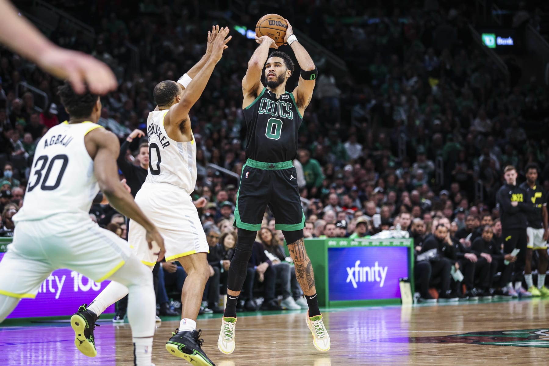 Boston, MA - March 31: Boston Celtics SF Jayson Tatum shoots a 3-pointer in the third quarter. The Celtics beat the Utah Jazz, 122-114. (Photo by Erin Clark/The Boston Globe via Getty Images)