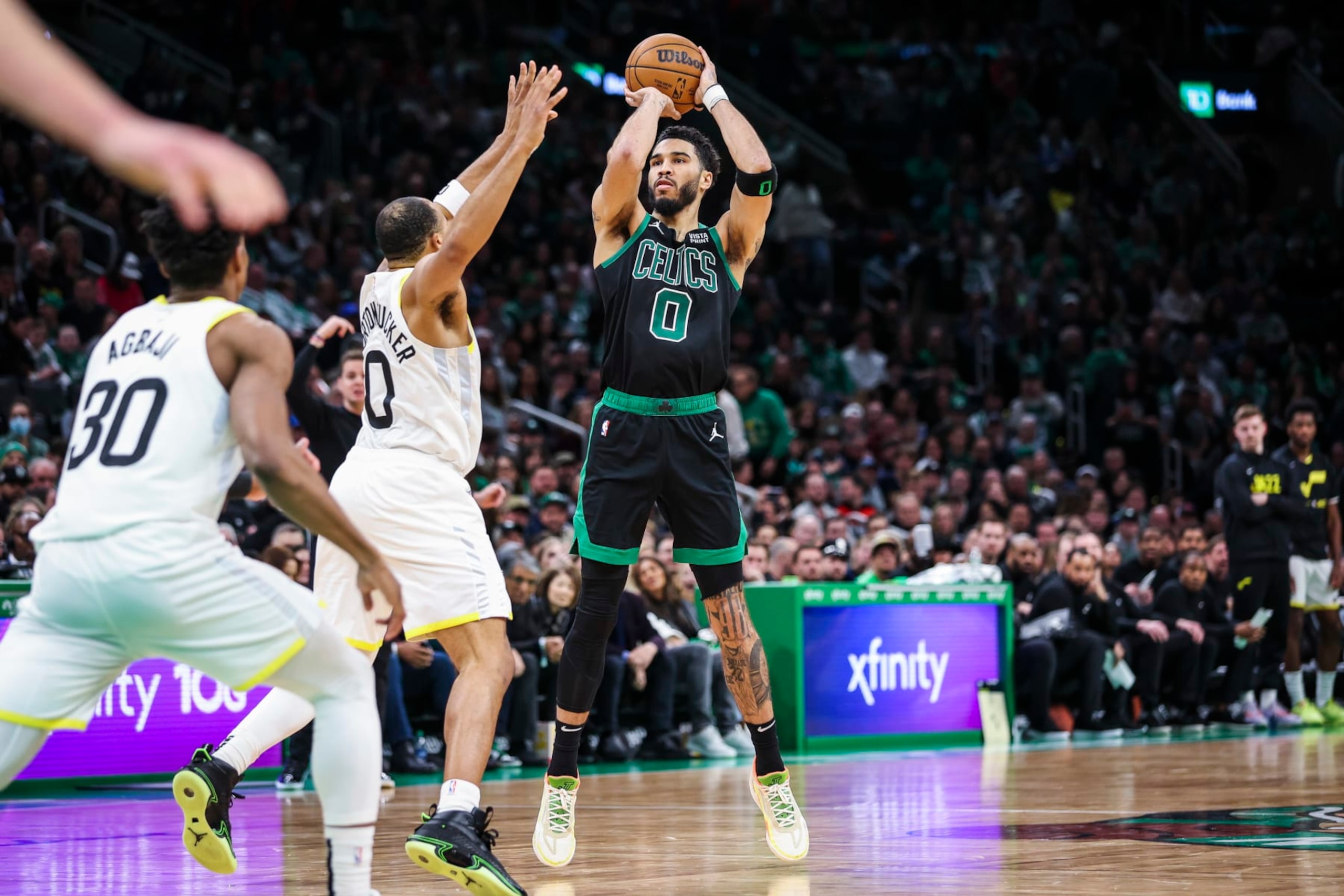 Boston, MA - March 31: Boston Celtics SF Jayson Tatum shoots a 3-pointer in the third quarter. The Celtics beat the Utah Jazz, 122-114. (Photo by Erin Clark/The Boston Globe via Getty Images)