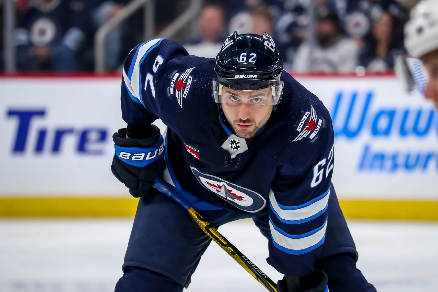 WINNIPEG, CANADA - APRIL 8: Nino Niederreiter #62 of the Winnipeg Jets looks on during a first period face-off against the Nashville Predators at the Canada Life Centre on April 8, 2023 in Winnipeg, Manitoba, Canada. (Photo by Darcy Finley/NHLI via Getty Images)