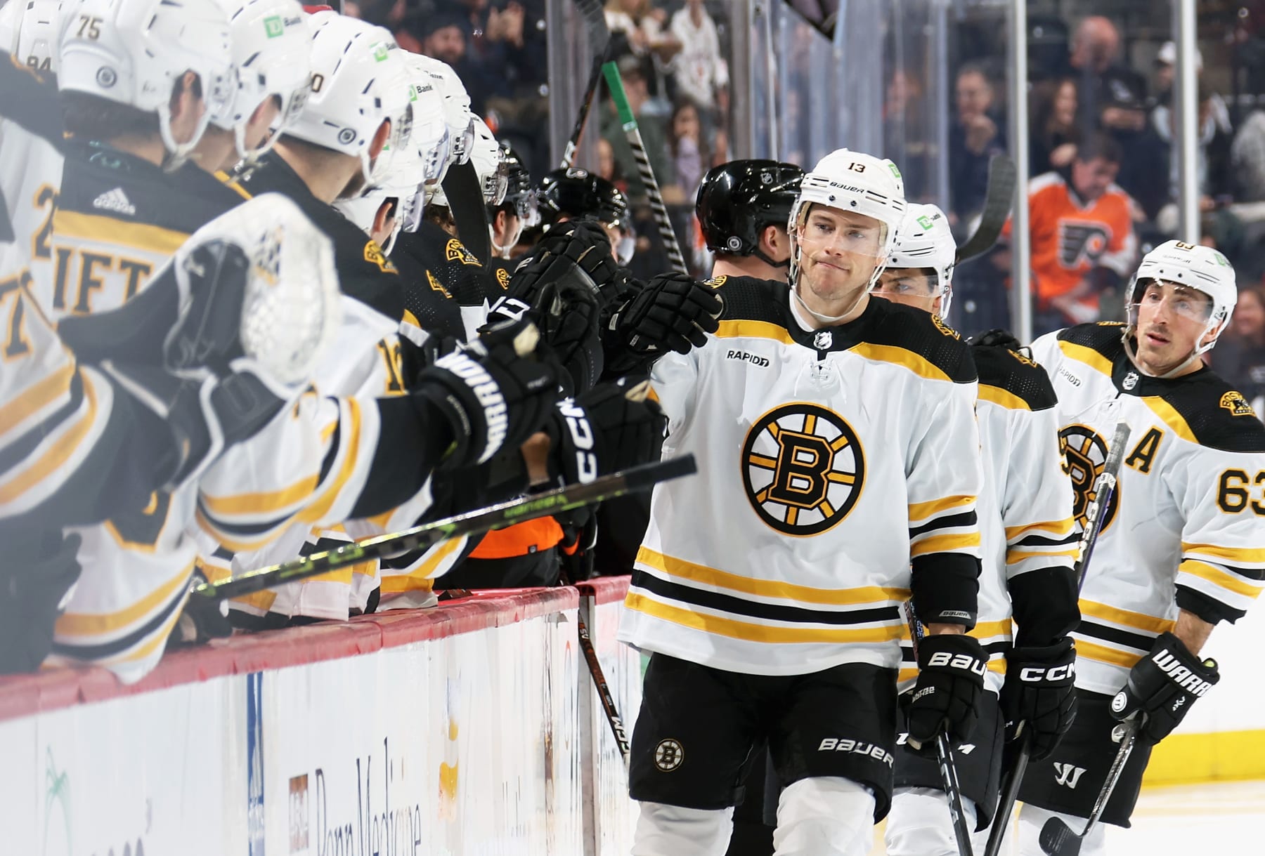 PHILADELPHIA, PENNSYLVANIA - APRIL 09: Charlie Coyle #13 of the Boston Bruins celebrates his first period goal against the Philadelphia Flyers with his teammates on the bench at the Wells Fargo Center on April 9, 2023 in Philadelphia, Pennsylvania.  (Photo by Len Redkoles/NHLI via Getty Images)