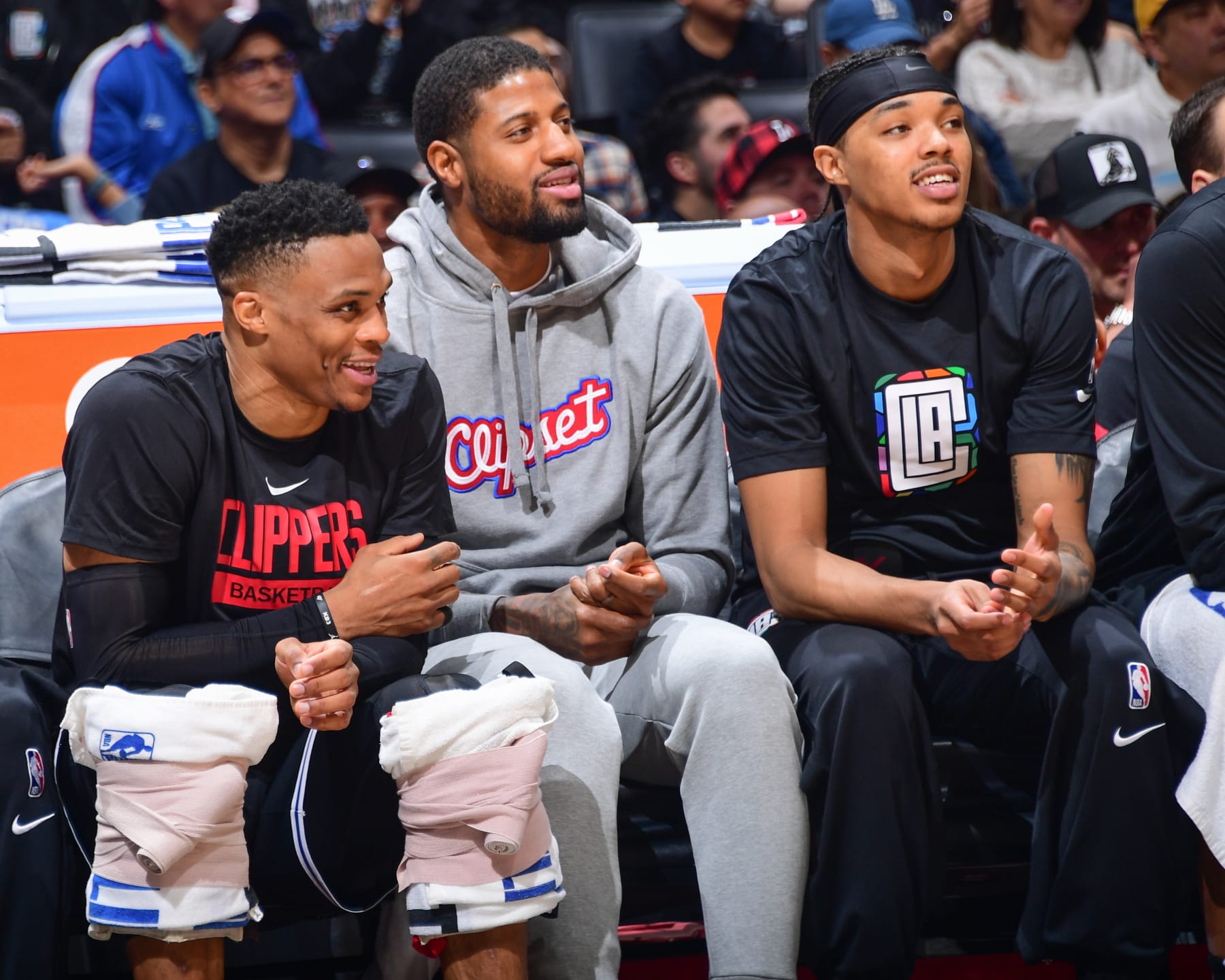 LOS ANGELES, CA - APRIL 8:  Brandon Boston Jr. #4, Paul George #13 and Russell Westbrook #0 of the LA Clippers sit courtside during the game on April 8, 2023 at Crypto.Com Arena in Los Angeles, California. NOTE TO USER: User expressly acknowledges and agrees that, by downloading and/or using this Photograph, user is consenting to the terms and conditions of the Getty Images License Agreement. Mandatory Copyright Notice: Copyright 2023 NBAE (Photo by Adam Pantozzi/NBAE via Getty Images)