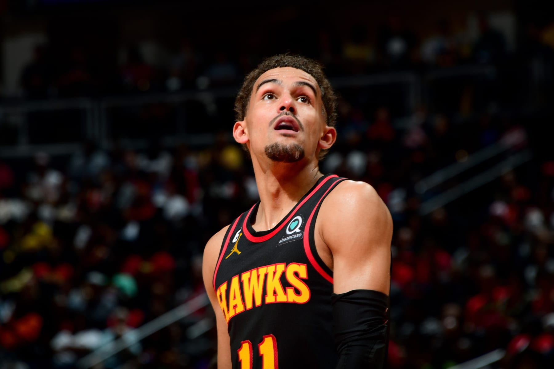 ATLANTA, GA - APRIL 7: Trae Young #11 of the Atlanta Hawks looks on during the game against the Philadelphia 76ers on April 7, 2023 at State Farm Arena in Atlanta, Georgia.  NOTE TO USER: User expressly acknowledges and agrees that, by downloading and/or using this Photograph, user is consenting to the terms and conditions of the Getty Images License Agreement. Mandatory Copyright Notice: Copyright 2023 NBAE (Photo by Scott Cunningham/NBAE via Getty Images)