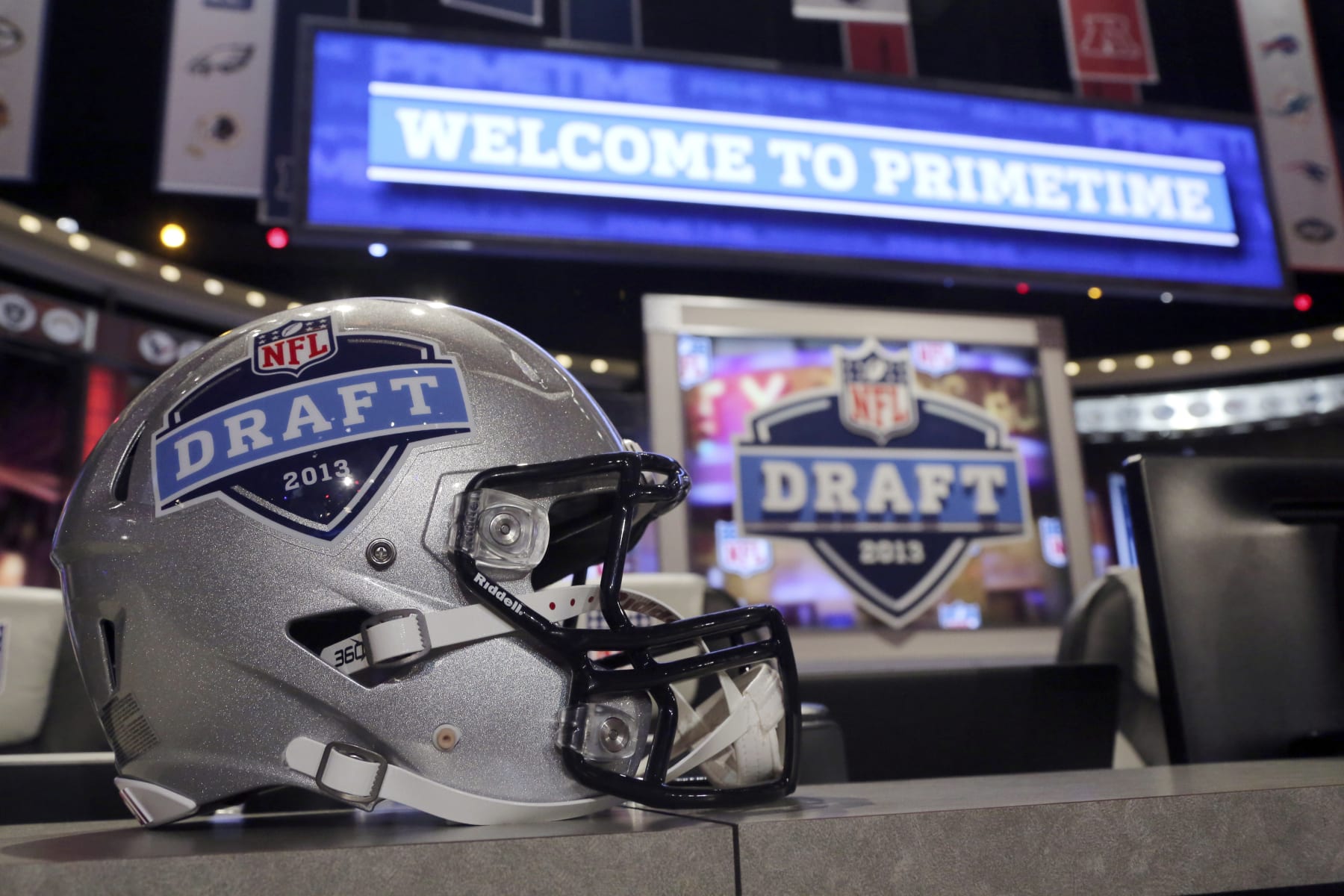 A helmet with the NFL football draft logo is placed on a table before the first round, Thursday, April 25, 2013, at Radio City Music Hall in New York. (AP Photo/Mary Altaffer)