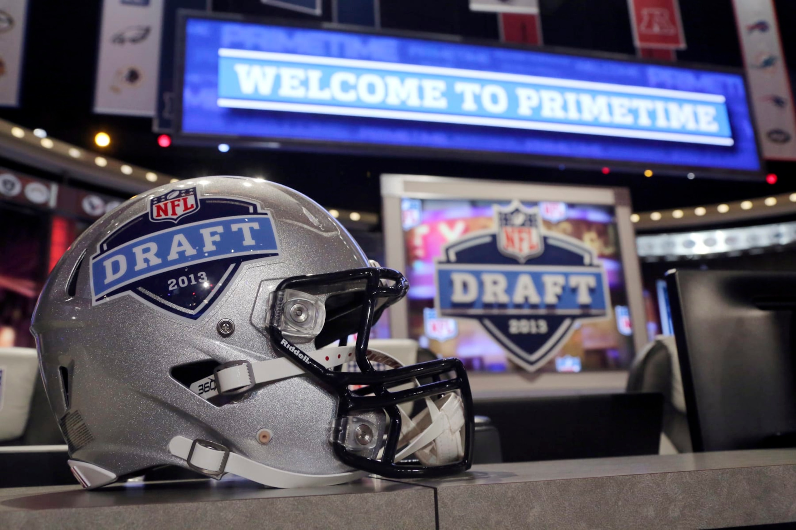 A helmet with the NFL football draft logo is placed on a table before the first round, Thursday, April 25, 2013, at Radio City Music Hall in New York. (AP Photo/Mary Altaffer)